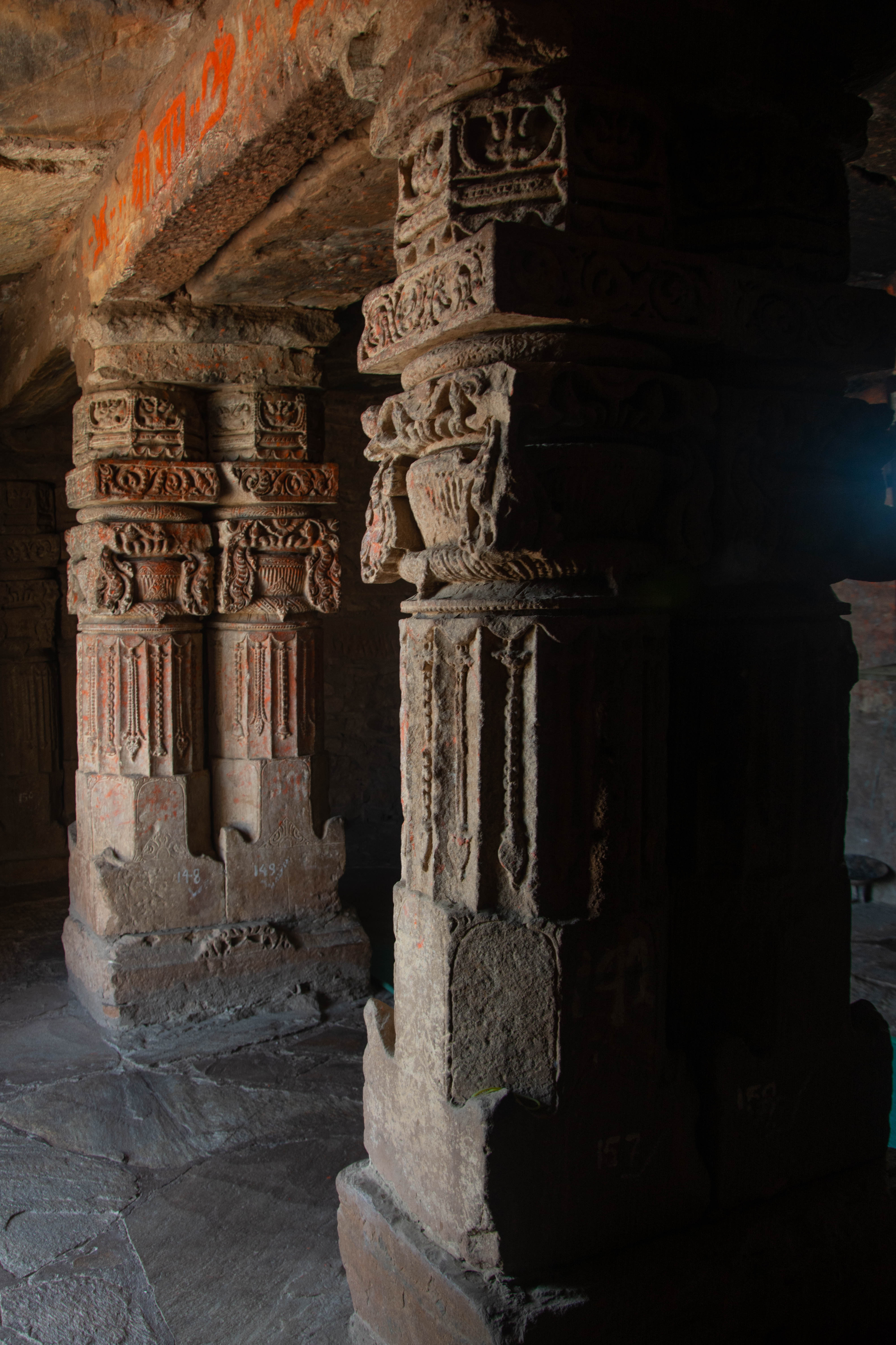 This late mediaeval structure has these pillars, which were once part of the mandapa of a temple, attached to it. The purna-kalasha is beautifully carved.