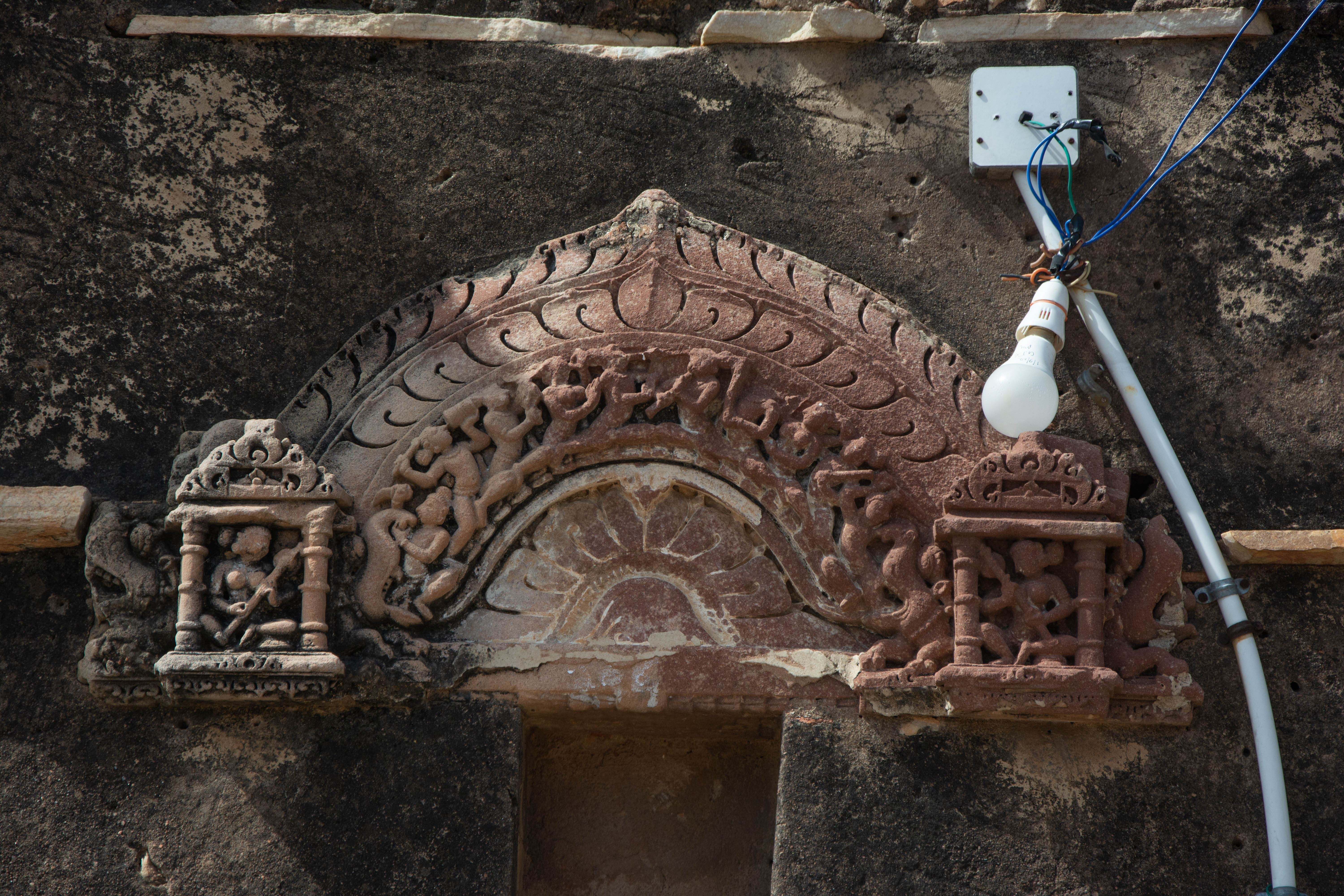 The fragment, which likely served as the background frame behind the independent image of the sanctum, is affixed to a late structure.