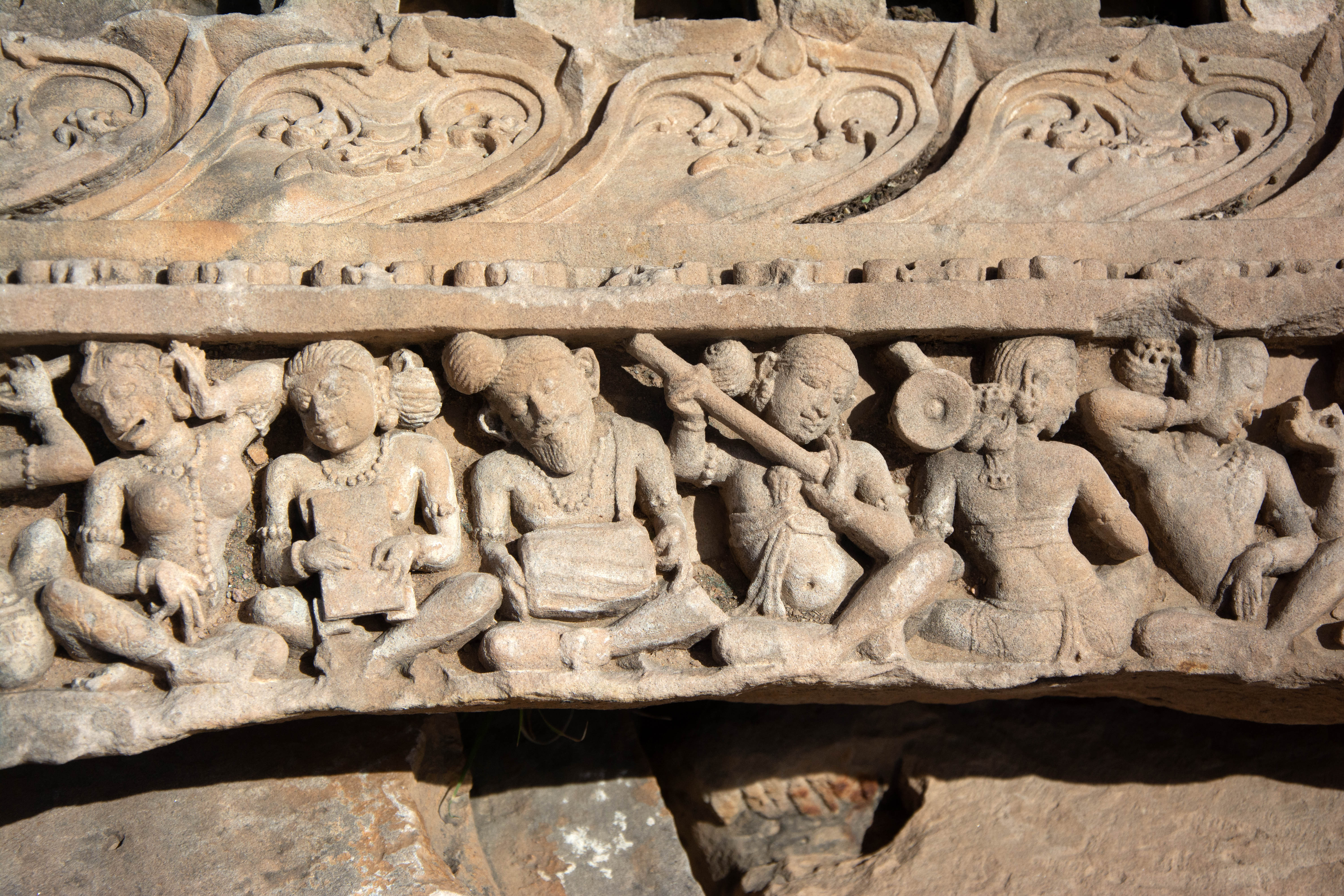 There are many loose architectural fragments scattered within the Harshnath Temple Complex. This fragment depicts musicians singing or playing a variety of musical instruments. A male with long hair and a beard is playing the drum in the center.