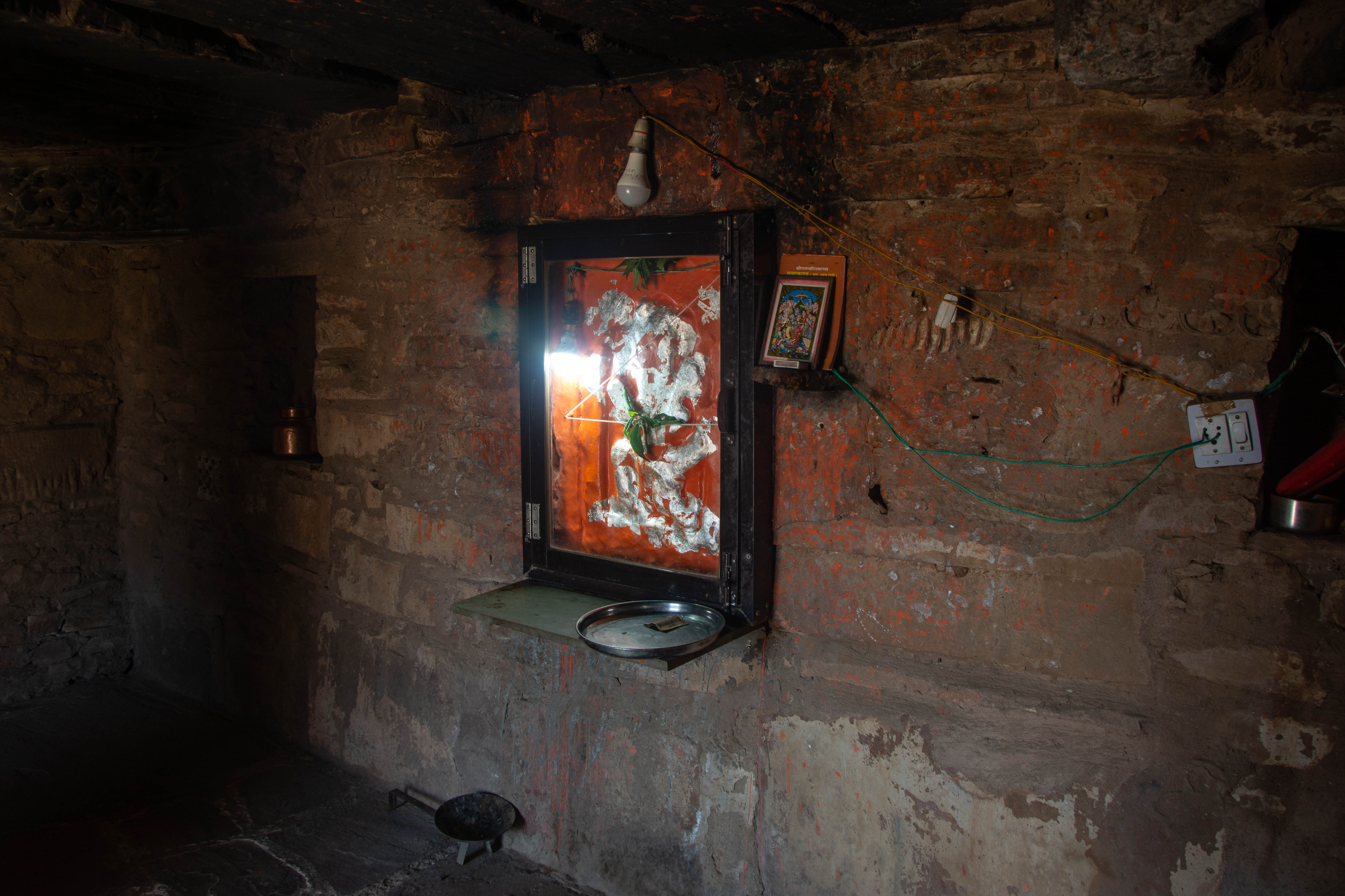 The idol is actively worshipped inside one of the late medieval structures on Harsha Hill. It is excessively smeared with paint and silver, making it challenging to determine its dating or identification.