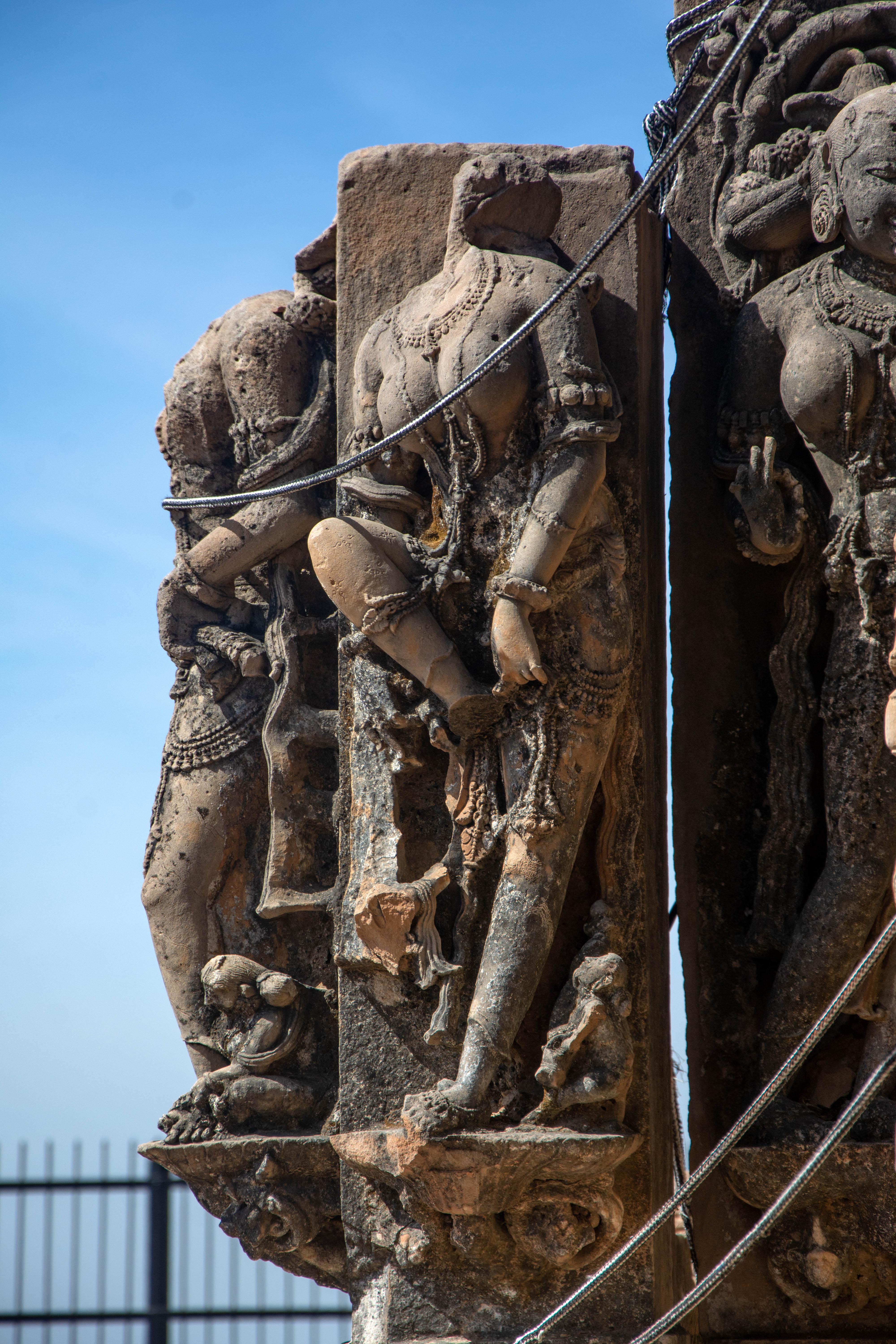 The southeast corner of the Harshnath Temple depicts elegant surasundaris raising their right leg with their left arm.