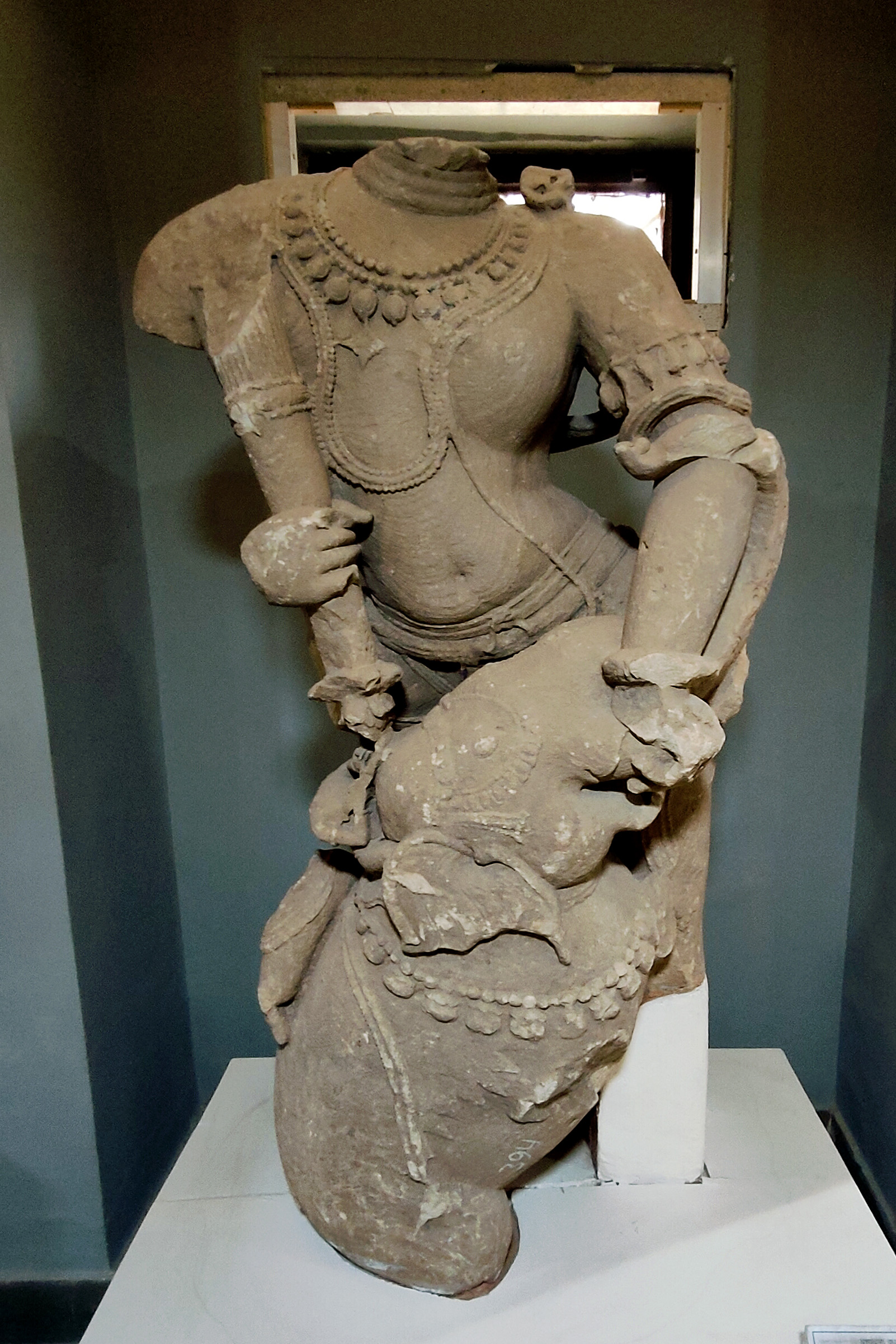 The label at the Government Museum in Sikar identifies the figure as the 'Killing of Asavathama elephant by Pandava prince, Bhima'. However, the identification has little support beyond speculation. Given the size of the figure and its delicate rendition, another speculation arises, suggesting it may depict Shiva as Gajantak, the killer of the demon elephant.