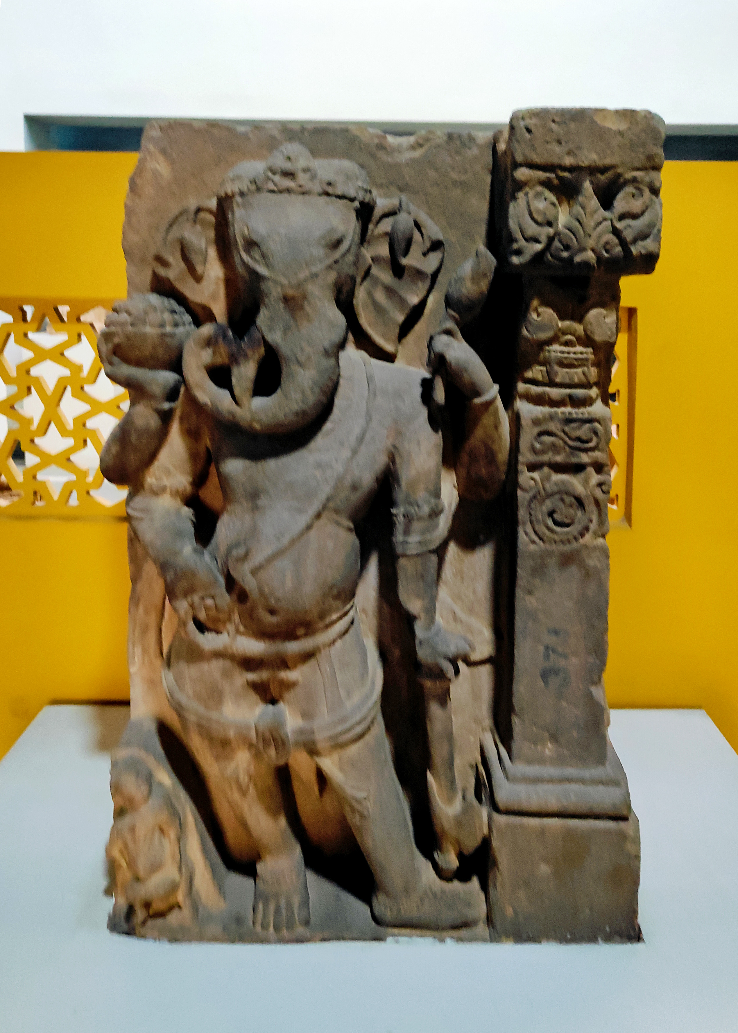 The Government Museum in Sikar now houses a four-armed Ganesha that once adorned the temple wall on Harsha Hill. The depiction shows Ganesha holding an axe and a mala in his lower two hands. The upper two hands hold a bowl of sweets and, possibly, a flower.