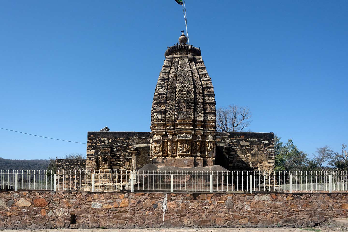 Image 3: Seen here is the eastern elevation of the Neelkanth Mahadev Temple. The central shrine is the best preserved of all shrines in the tri-kuta temple. The Latina Nagara variety of shikhara atop the central shrine of the Neelkanth Mahadev Temple has been renovated.