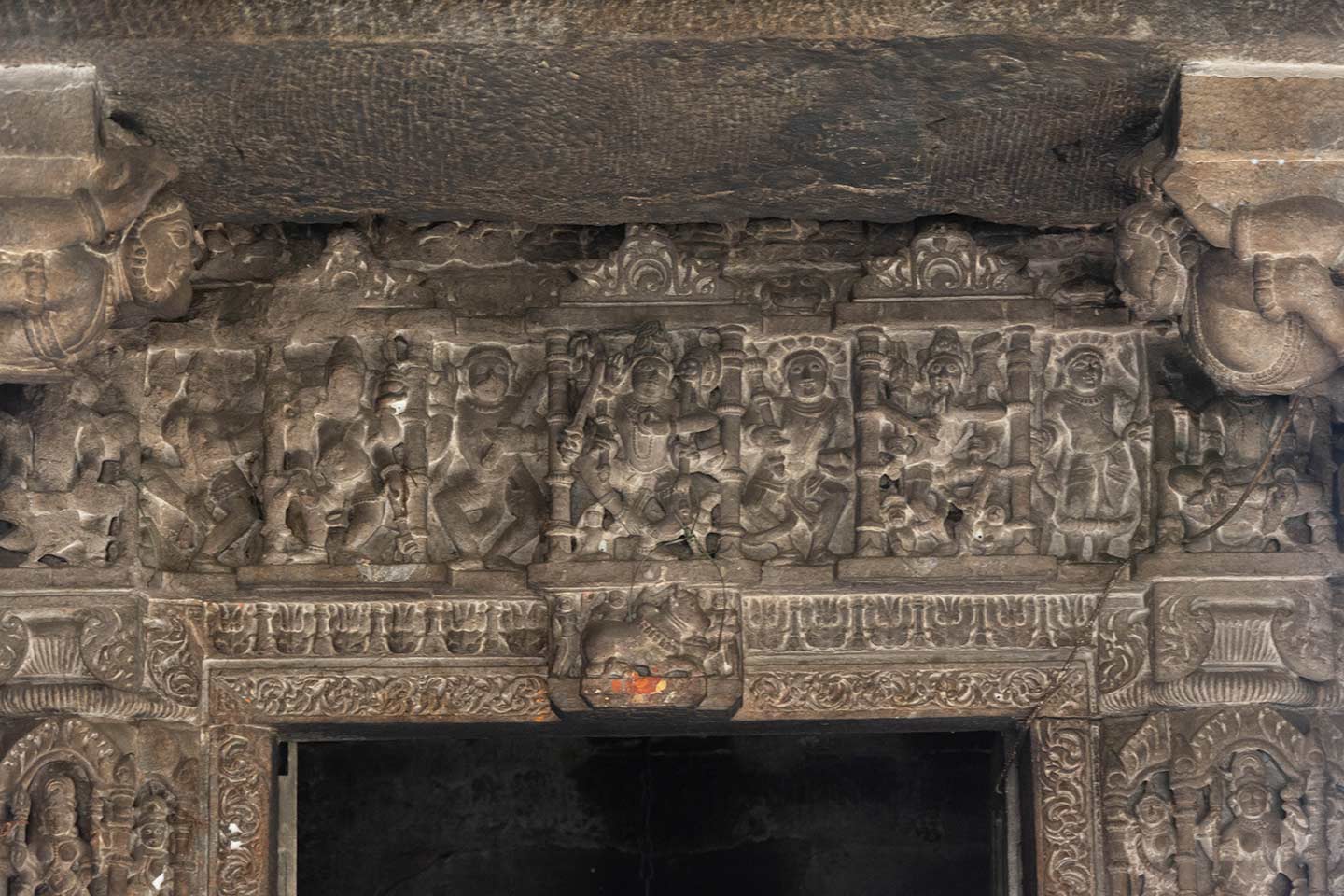 Image 5: A closer view of the lalatabimba (key stone of the lintel) of the dvarashakha (doorjamb) of the central shrine of the Neelkanth Mahadev Temple. This lintel has five rathikas (small niches) with depictions of Shiva at the centre, flanked by Ganesha on the right and a goddess on the left. The extreme corner rathikas are not easily accessible. Since the central rathika of the lintel has a Shiva image, the lalatabimba has an image of Nandi.