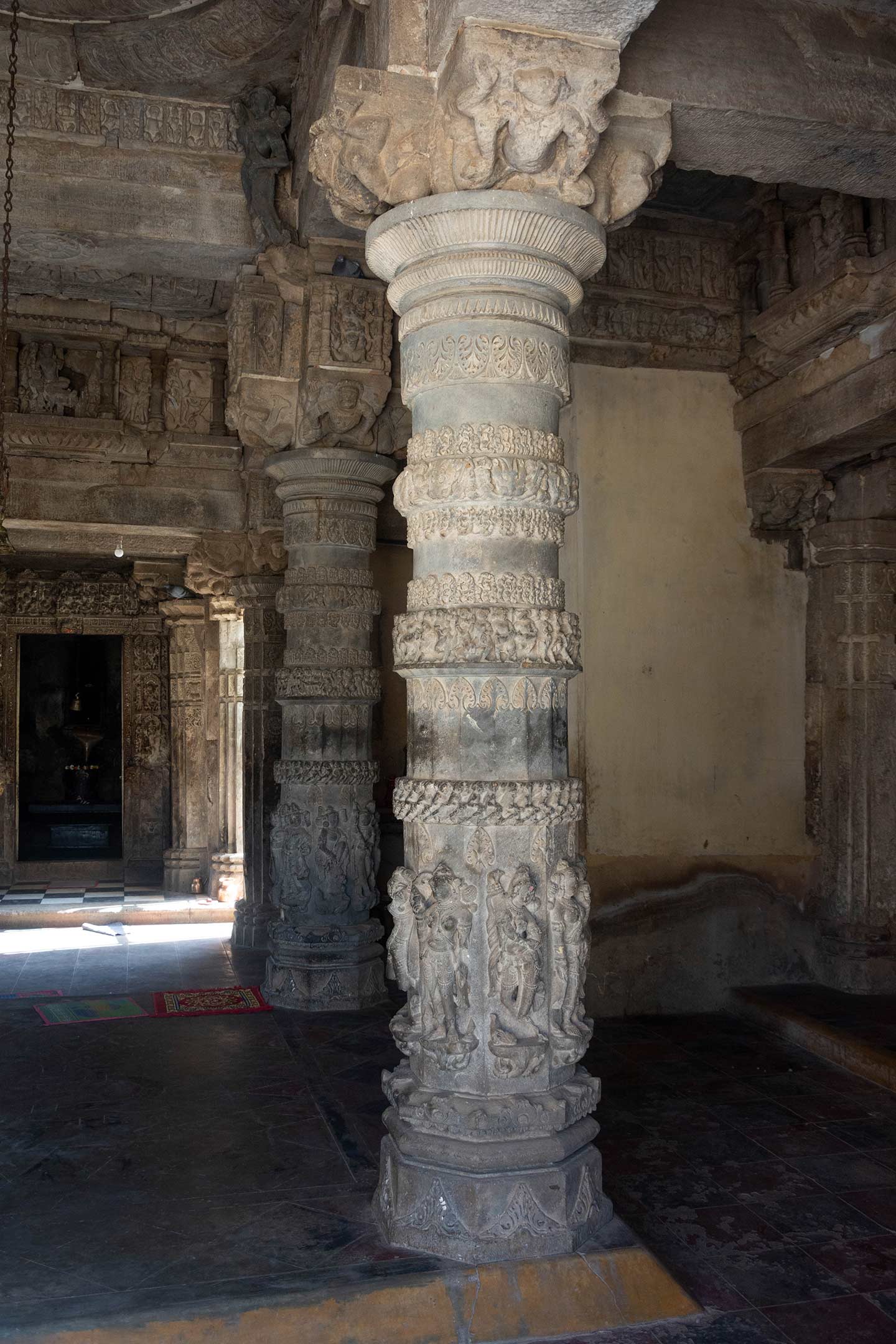 Image 6: Closer view of the pillar in the central chatuski of the mandapa (pillared hall) of the Neelkanth Mahadev Temple. This pillar typology is similar to the pillars of the mukhamandapa (front porch). Octagonal shafts with foliage ornamentation, maladharas sculptures on all sides of the shafts are characteristics of the pillar.