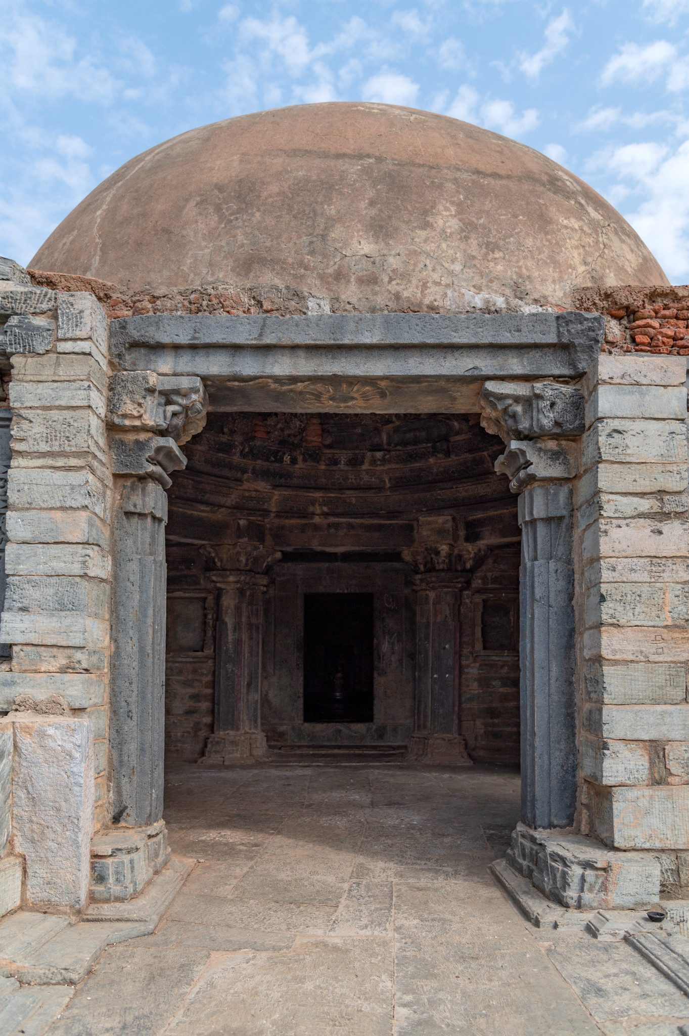 This is the main mandapa (pillared hall) entrance to the Kumbheshwar Mahadev Temple. The mandapa's outer walls have undergone restoration.