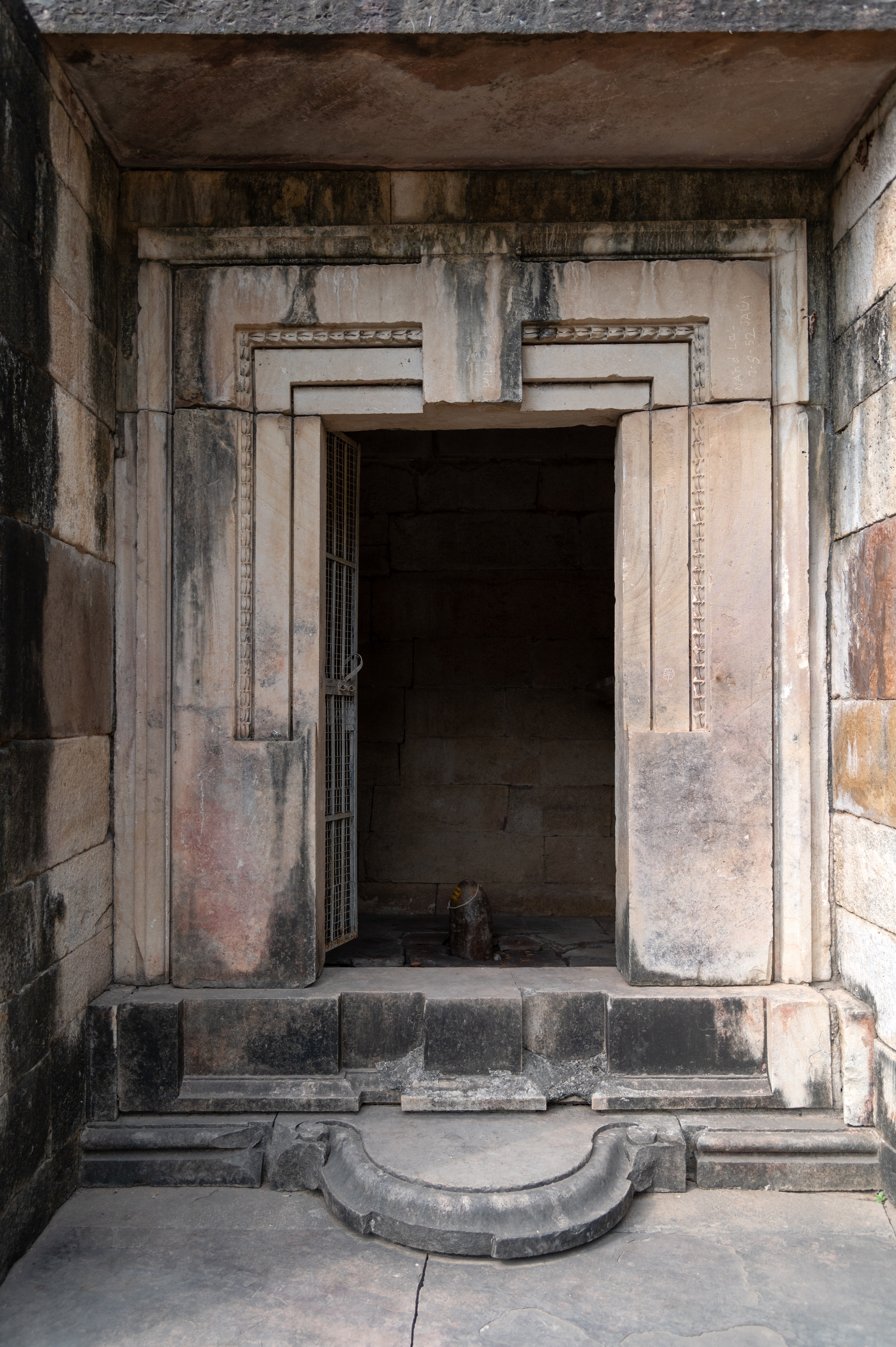 A closer view of the entrance of the Shiva Temple (Temple 1) in Cluster 1. The antarala (vestibule) of the temple is shallow and devoid of a niche or sculptures. The entrance gate of the garbhagriha (sanctum sanctorum) also shows minimal decoration. The lalatabimba (lintel) has no figure present.