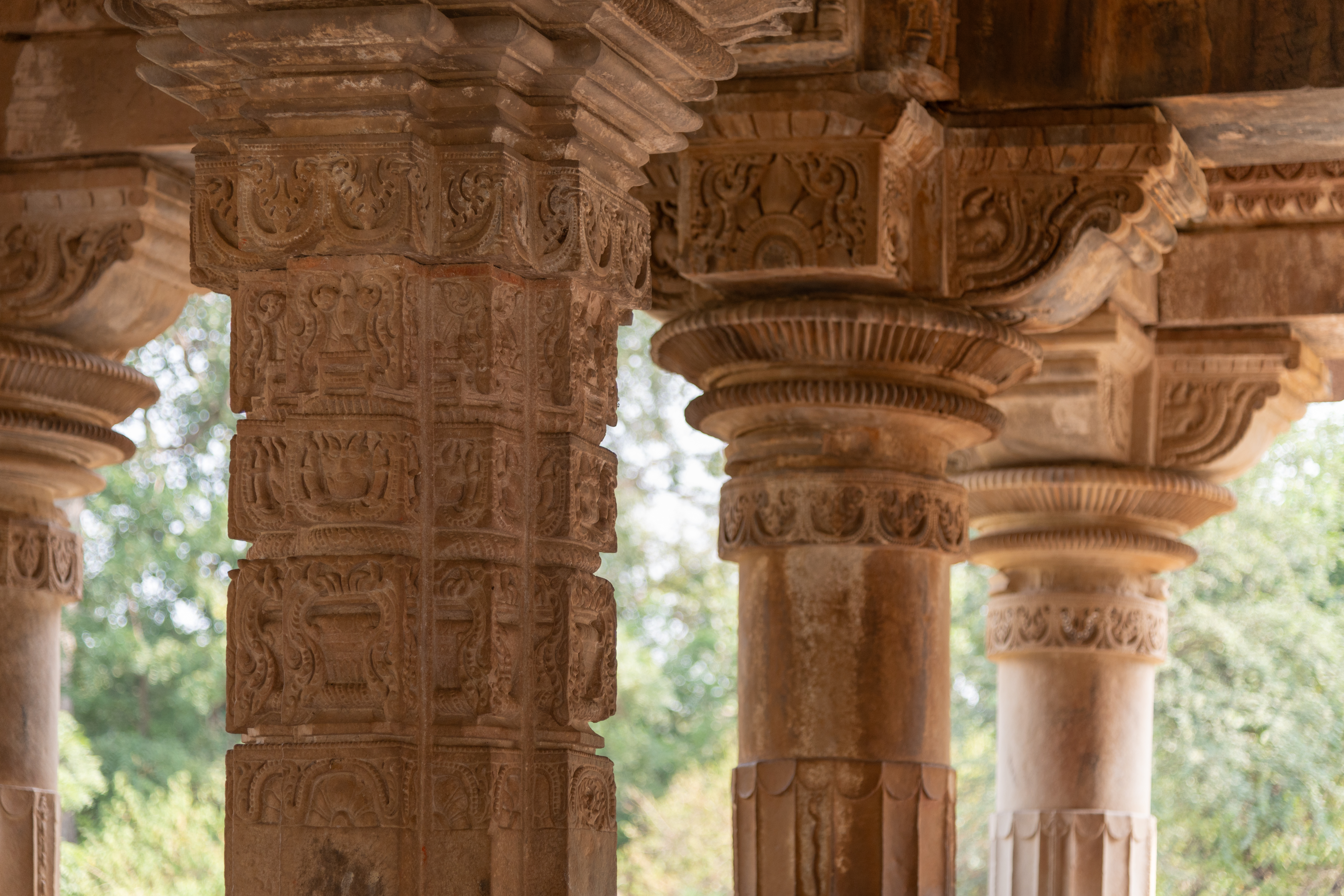 The pillars of the rangamandapa (open type of pillared hall) feature a variety of motifs which are used to decorate these pillars. The square pillars are adorned with the purnaghata kalasha (vase of plenty), an auspicious decorative motif commonly found in Indian temples. The other motifs include a grassamukha, also known as kirtimukha (face of glory), as well as a leaf and beaded loop motif and a half medallion filled with flowers and birds.