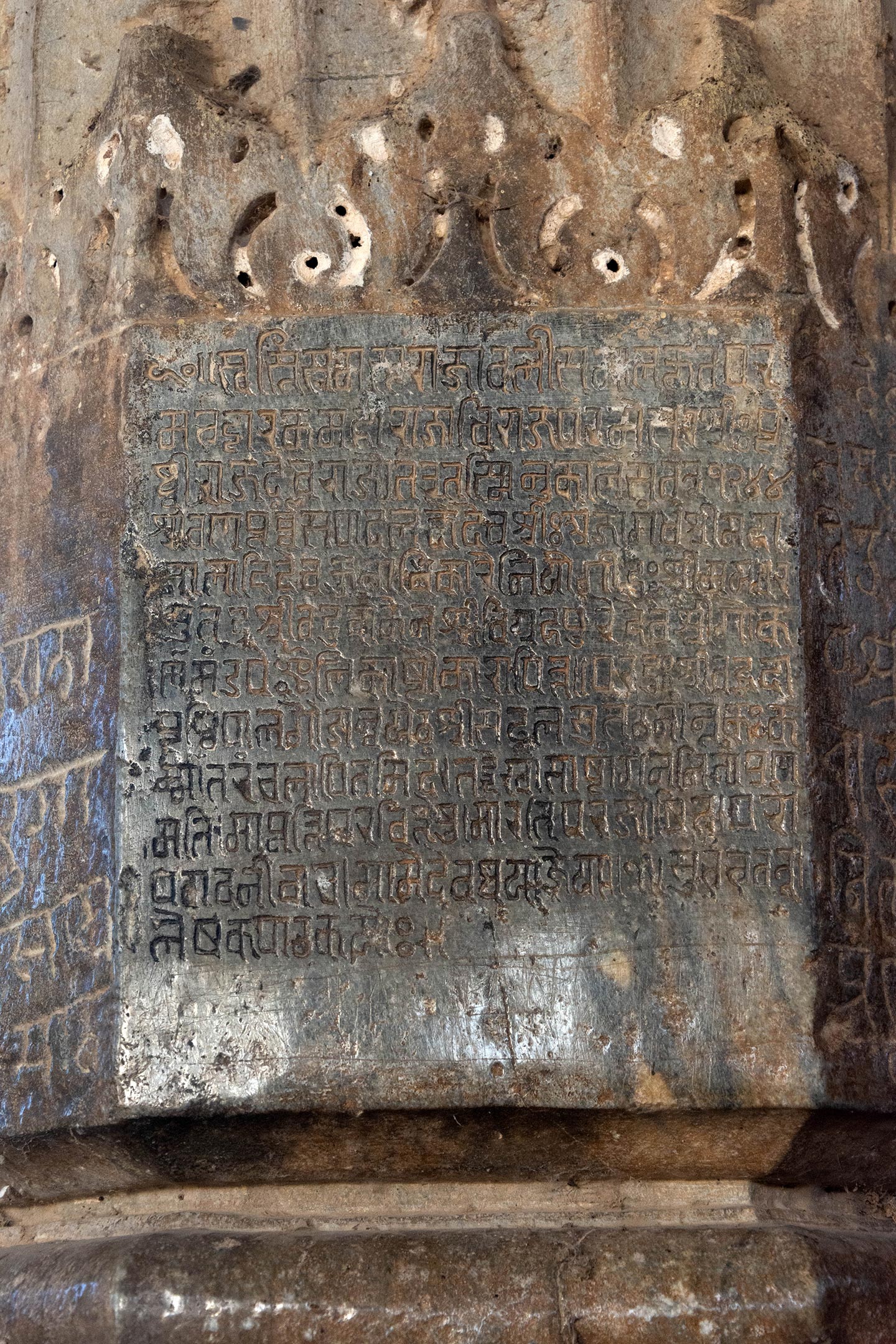 This inscription, dated 1187 CE (VS 1244), was composed during the reign of Prithivaraja Chauhan and records the donation of two sword handles to the mandapa (pillared hall) of the temple of Sri Gokarna in Vigrahapura (Bisalpur). It is inscribed on a pillar in the mahamandapa (pillared hall) alongside other informative inscriptions. The inscription underscores the strong association between the city of Vigrahapura (Bisalpur) and King Vigraharaja IV, also known as Bisaldeo, who is celebrated in oral accounts and medieval bardic accounts as the temple’s patron. The mention of the city’s name in the inscription solidifies this connection. Furthermore, it establishes the original name of the temple as the temple of Gokarna, derived from the name of the shivalinga housed within a nearby cave in the village.