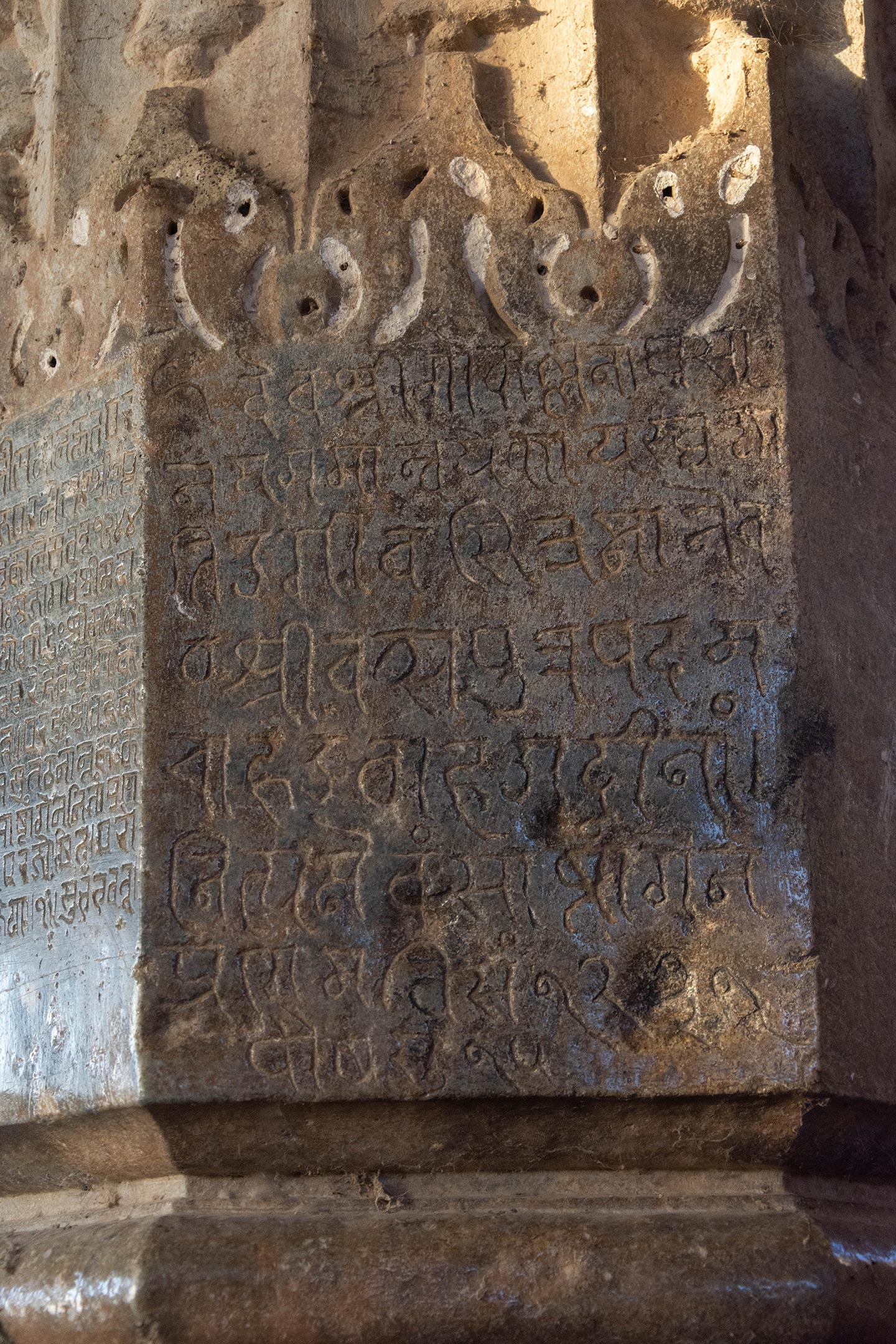 The inscription dated 1174 CE (VS 1231) commences with the words Deva shri Gokarllanaghvasi, reaffirming the deity’s name as Gokarna Deva. It is inscribed on a pillar within the mahamandapa (pillared hall) of the temple, alongside other informative inscriptions.