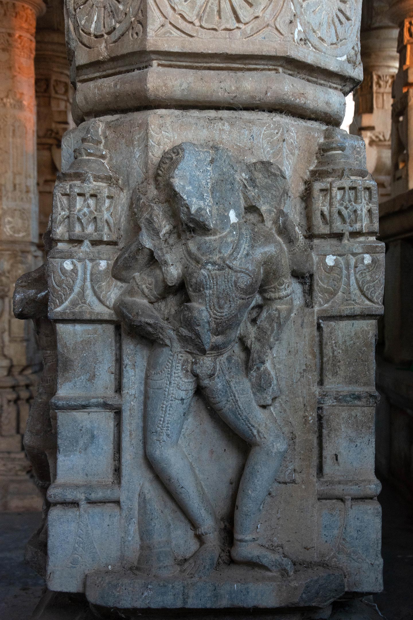 The only significant depiction of the divinity of Shiva is found in the form of a four-armed portrayal of Bhairava on a temple shaft near the entrance of the temple, within the mandapa. It is the first religious image encountered upon visiting the temple. He is adorned with a serpent necklace, but other identifying attributes have deteriorated over time. His heavily bejewelled naked body reveals his genitalia.