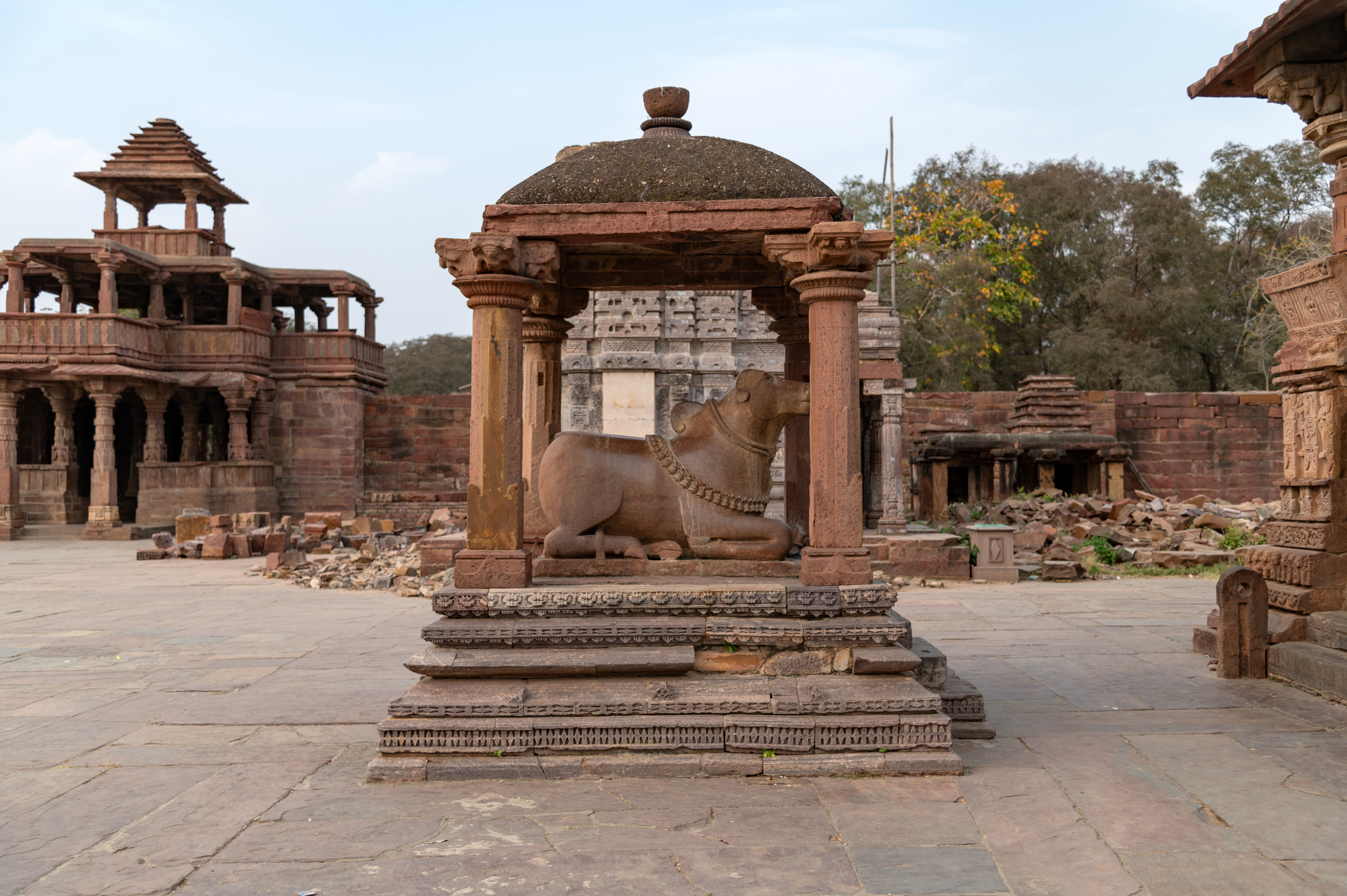 This is the Nandi mandapa (pillared hall), which faces the Mahanaleshwar Temple. It is an open mandapa consisting of a plinth with four pillars on its corners that support a canopy shikhara (superstructure). Nandi is facing the temple's garbhagriha (sanctum sanctorum). The sculpture is decked with jewels.