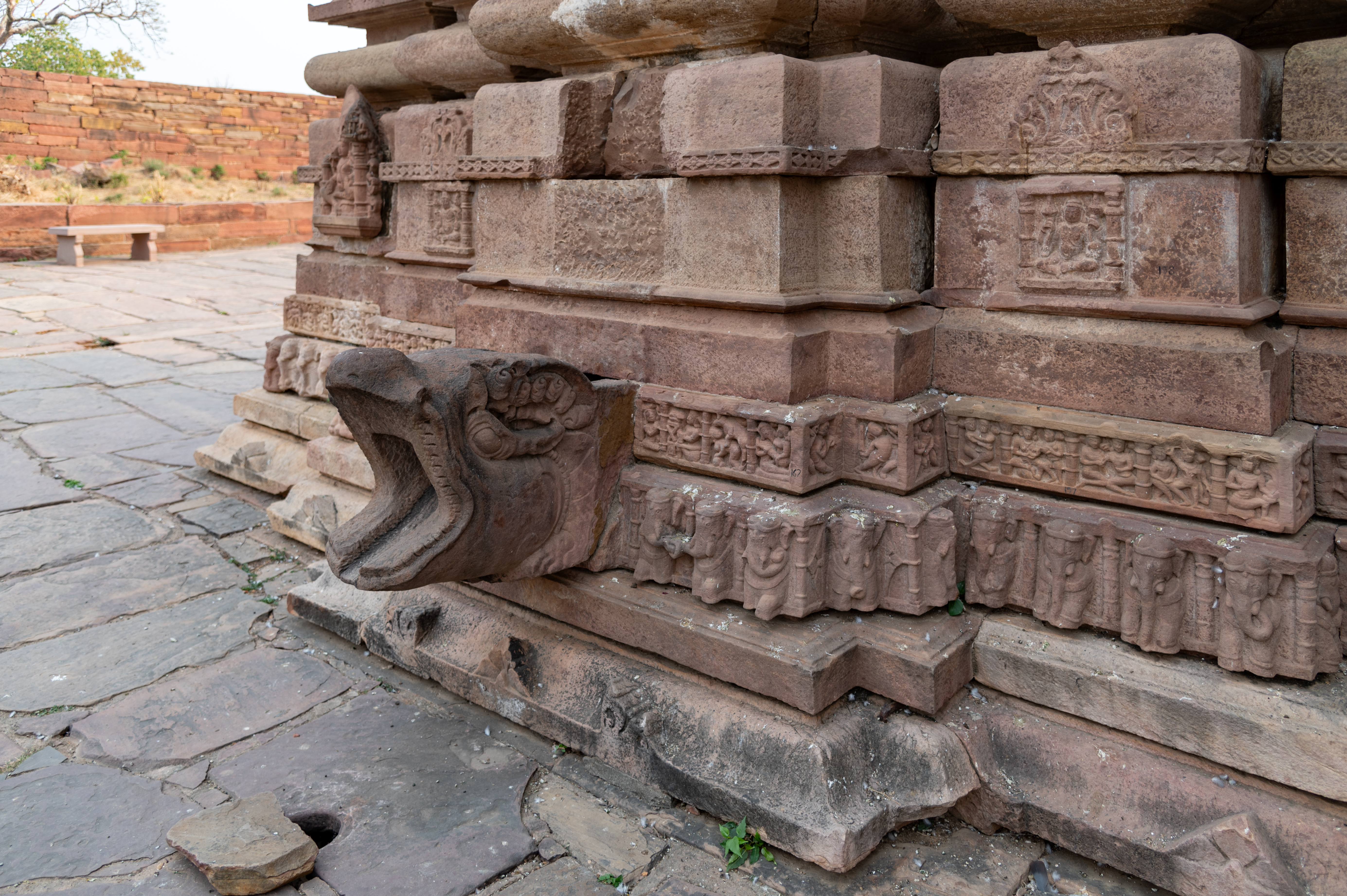 This plan also divides the vedibandha (basal mouldings) of the Mahanaleshwar Temple. In elevation, the mouldings consist of a jadyakumbha, gajathara, narathara, and a plain band followed by a broad kumbha moulding, kalasha, and kapotali. All these form the vedibandha section of the temple. The jadyakumbha (lotus-shaped moulding) has decorative motifs called the padma (lotus) and ardharatna (half diamond motifs). A pranala, a water chute, punctures the mouldings just below the central kumbha (pot), facilitating the passage of water from the inside of the garbhagriha (sanctum sanctorum).