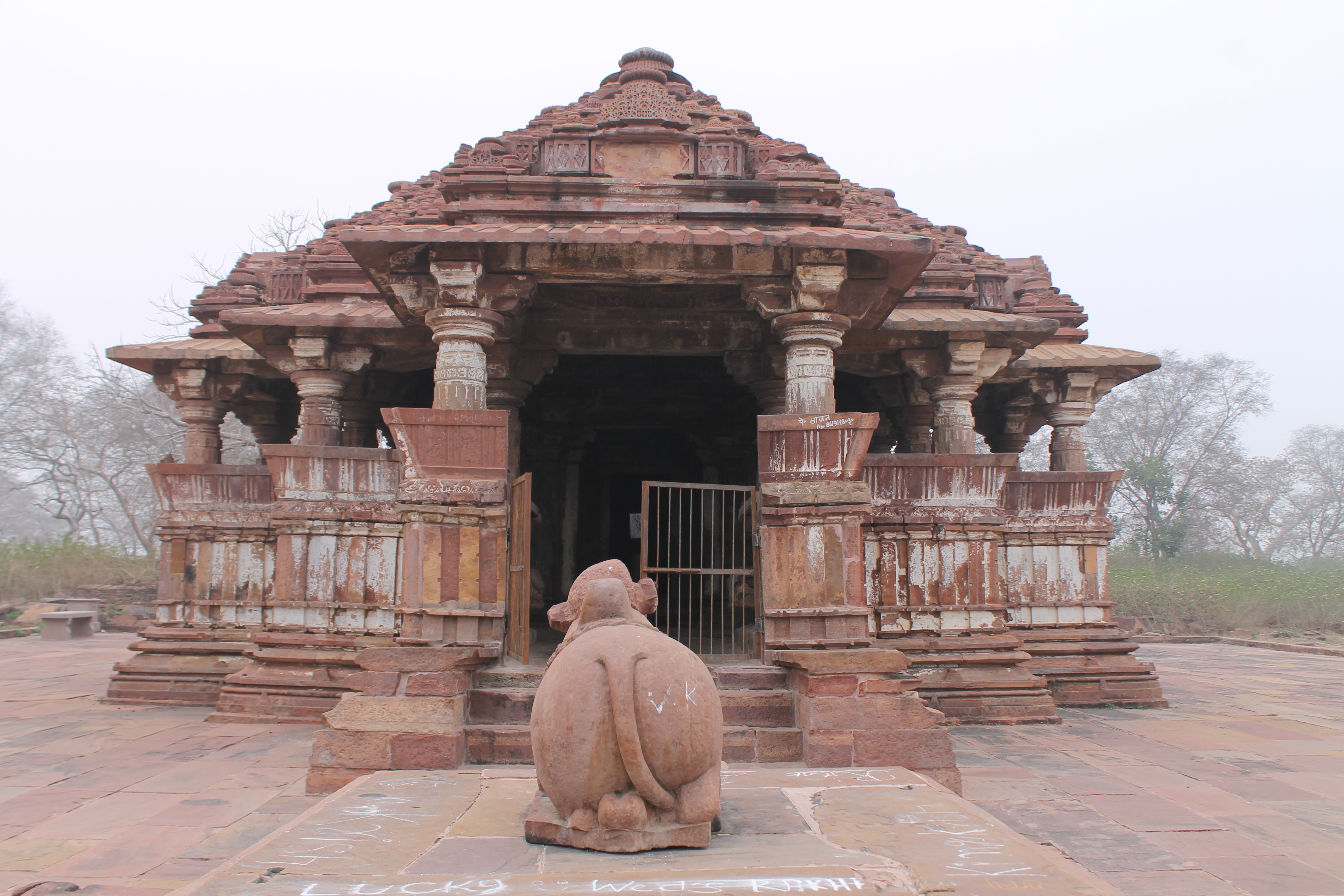 The Suhaveshwar Temple features an east-facing elevation and a principal entrance. A Nandi sculpture on a pedestal fronts the Suhveshwar Temple, but the superstructure of the mandapa (pillared hall) has collapsed.