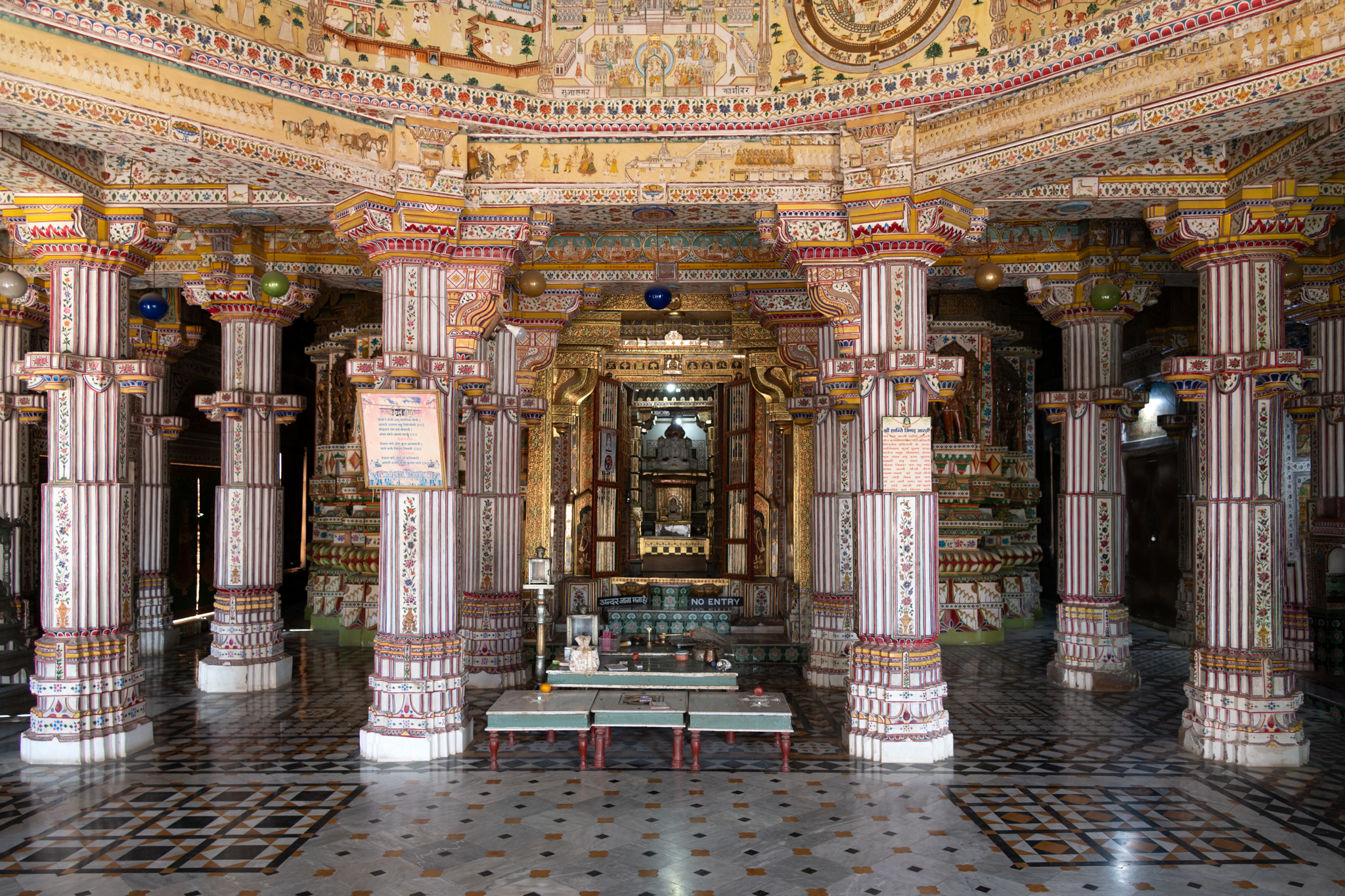 Image 4: View of the east-facing mandapa (pillared hall) of the Bhandasar Temple. The mandapa has eight main pillars that support the central dome. Beyond this intercolumniation lies the main garbhagriha (sanctum sanctorum), which enshrines Sumatinath Tirthankara. All the wall and pillar surfaces are painted.