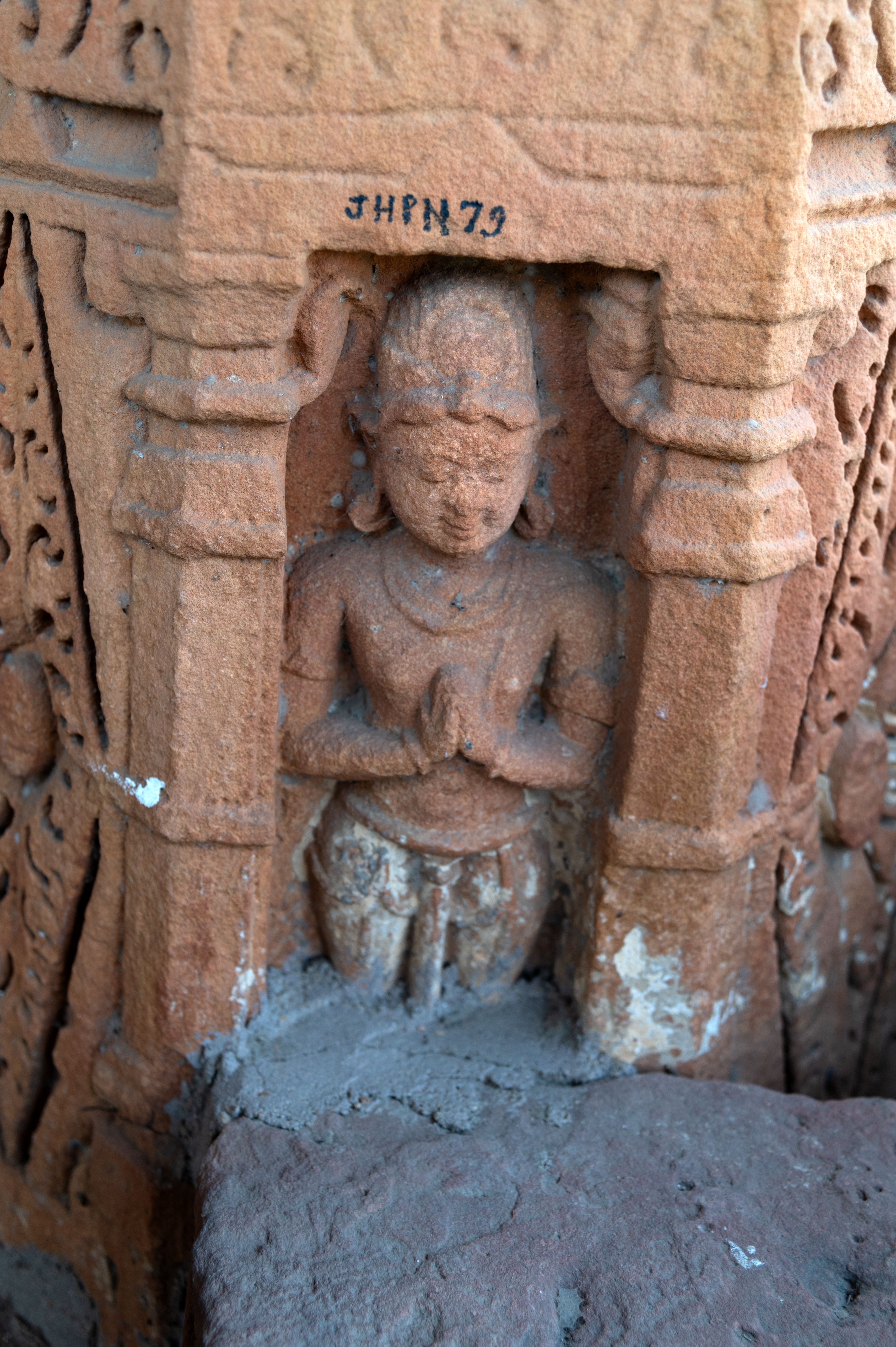 Some of the depictions on the pillars of the mandapa (pillared hall) of the Sitaleshwar Temple also feature worshippers and devotees. In one instance, there is a male figure standing with hands folded in reverence.
