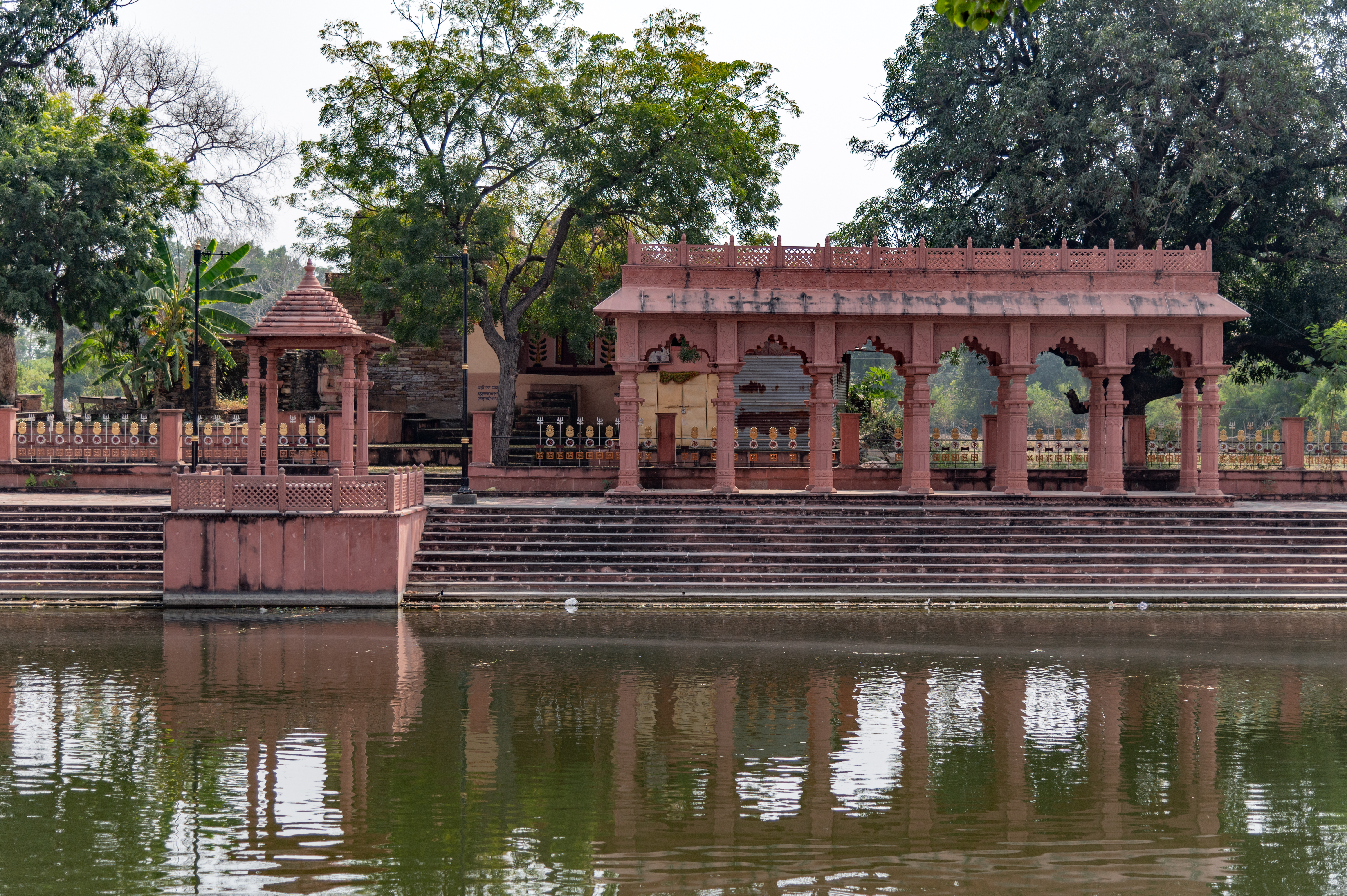 On the southern end of the Chandrabhaga temple complex, there is a ghat (bank) that has a few chhatris (memorial structures) and a few loose sculptures flanking the Chandrabhaga River. The devotees take a dip in the river, especially in the auspicious month of Kartik (October–November), and light diyas (oil lamps) in the temple and under the banyan tree.