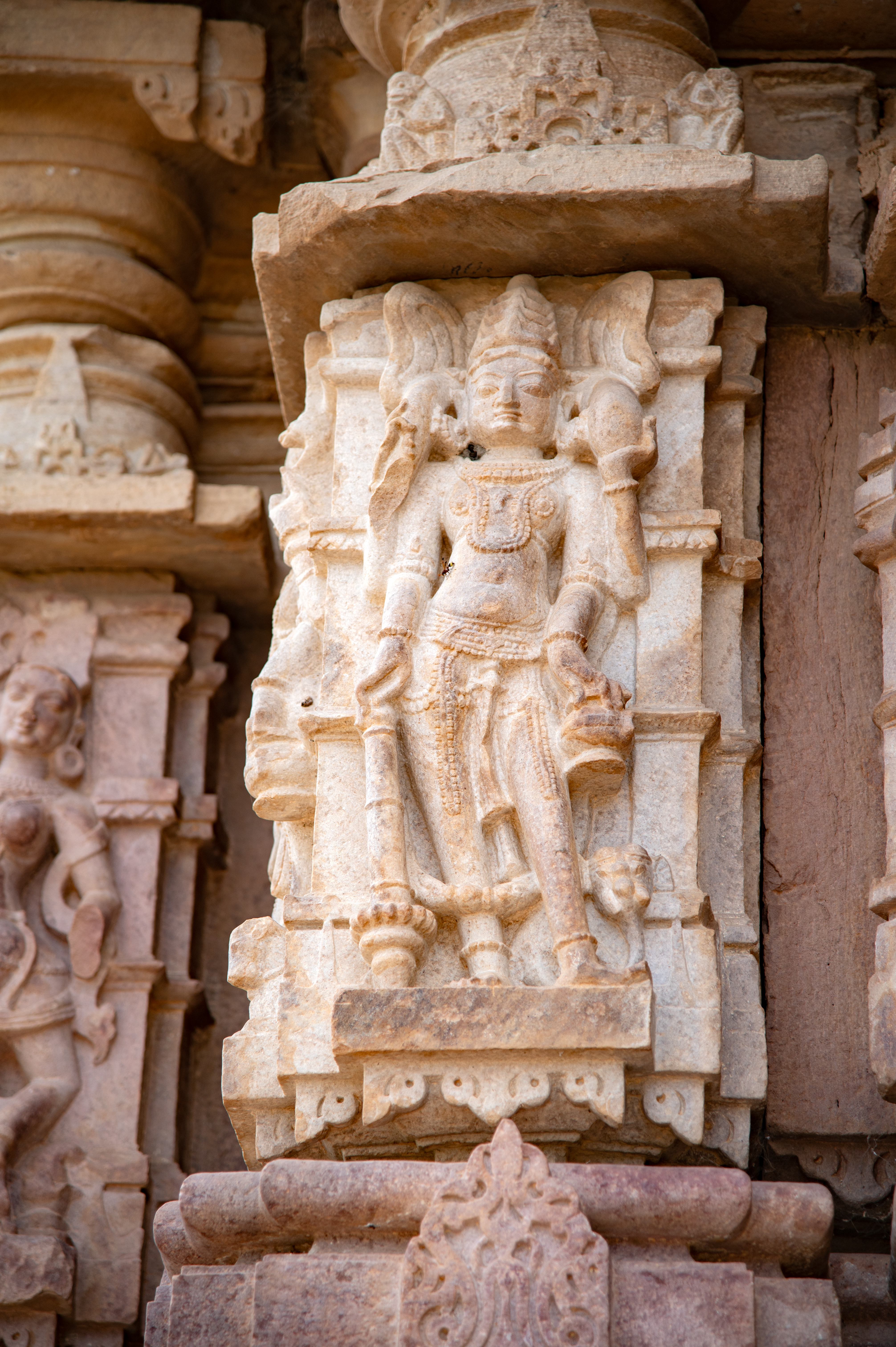 Kubera, the God of wealth, is depicted as four-armed, accompanied by his vahana (mount), the elephant. Crowned and bejewelled, Kubera holds a money bag in his upper hand, a gada (mace) in his lower right hand and a kamandalu (water pot) in his lower left hand.