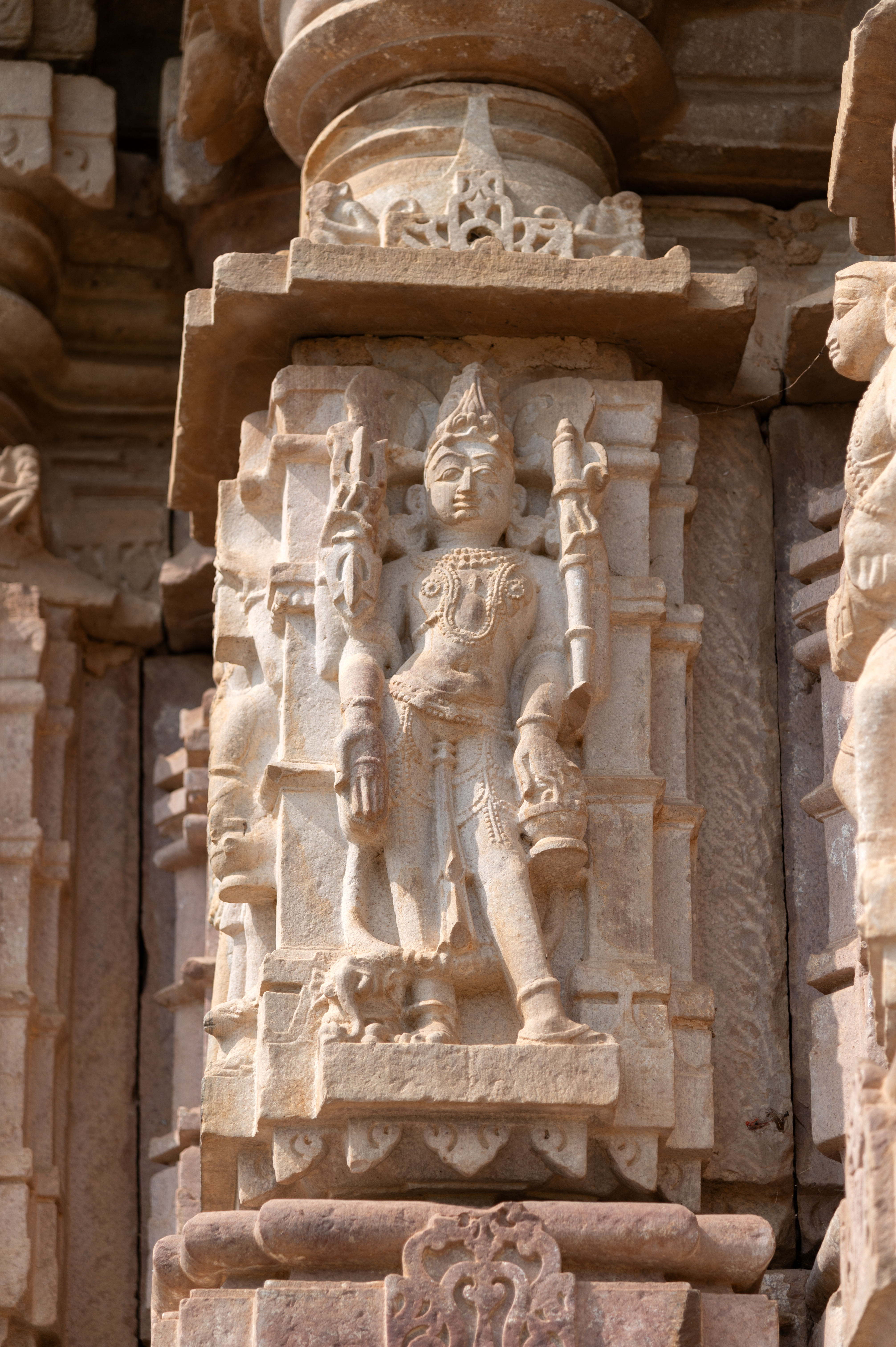 Indra, the God of heaven, is depicted with four arms. In his upper right hand, he holds a vajra (thunderbolt), and in his upper left hand, an ankusha (goad). His lower right hand makes a varada hasta (boon-giving gesture) and holds a rosary, while his lower left hand carries a kamandalu (water pot). Crowned, Indra is accompanied by his mount, the elephant.