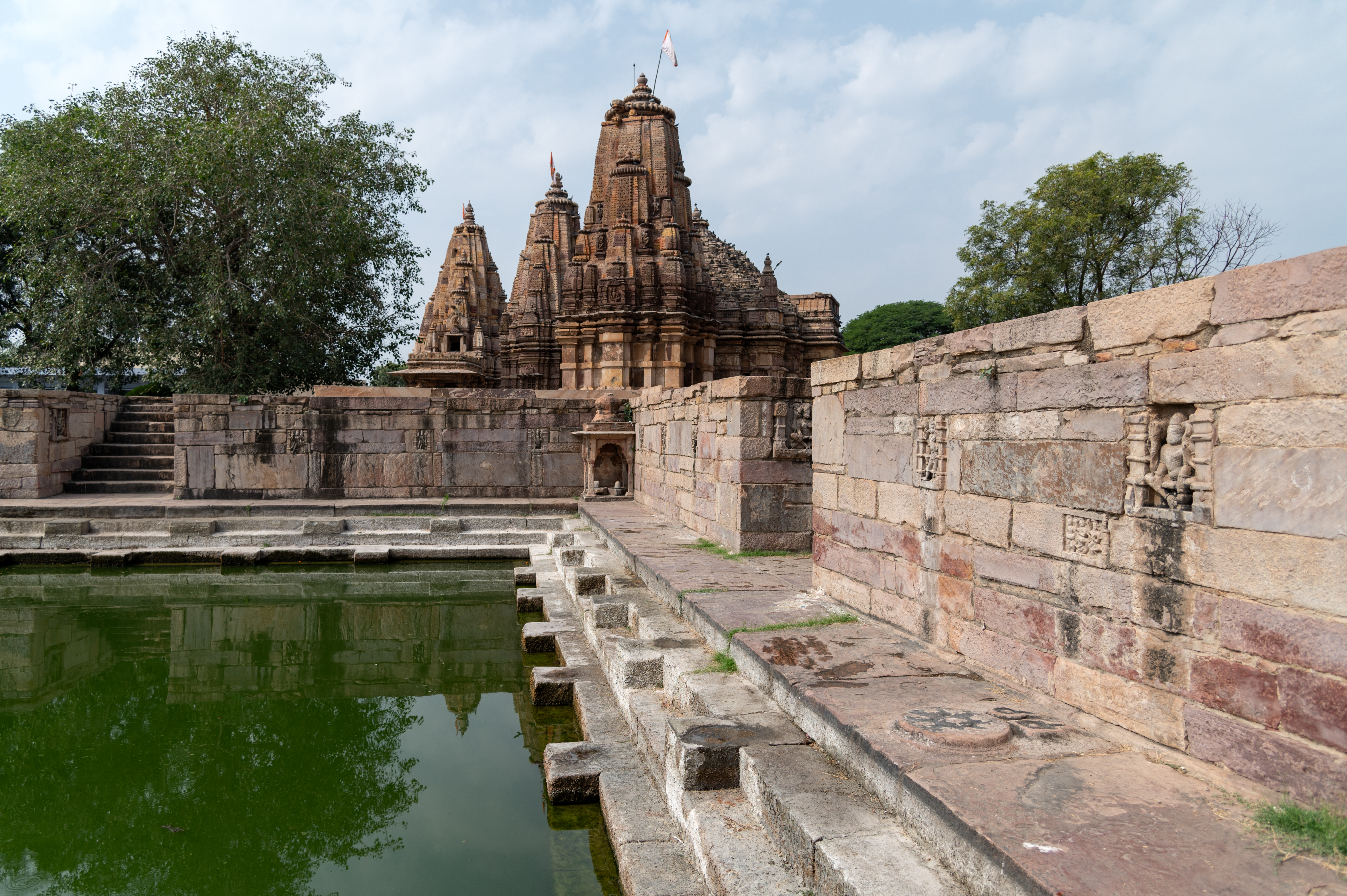 Image 5:  The interior surface of the enclosure walls, similar to the entrances, features several sculptures such as Brahma, Vishnu, and Mahesha, dikapalas (deities of cardinal directions), surasundaris (celestial maidens) and vyalas (composite mythical creatures).