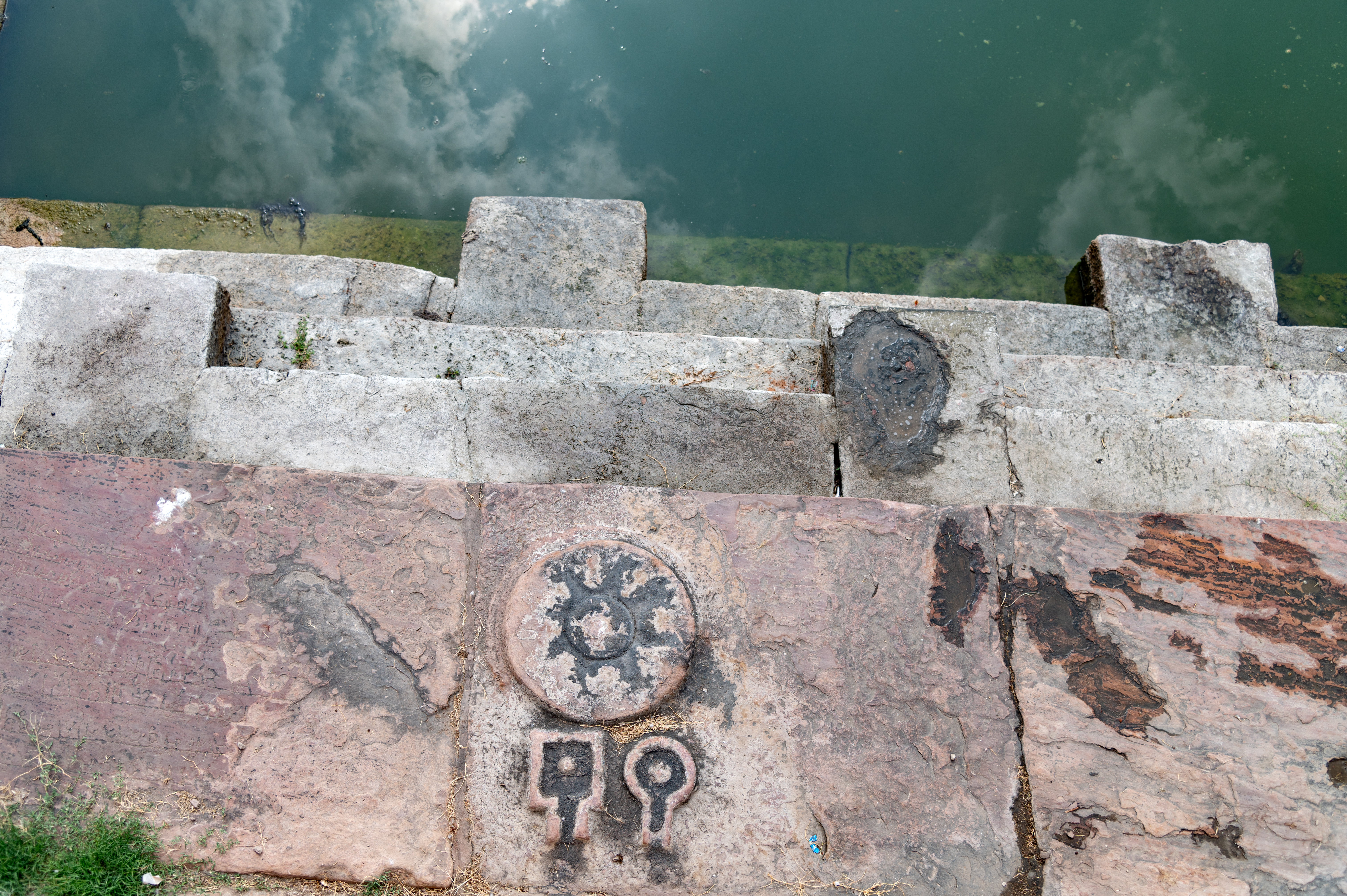 Image 7: Small Shiva lingas (aniconic representation of Shiva) are carved on the stairs of the kund. This suggests that the kund served not only as a place for ritual bathing and cleansing but also as a significant location for offering prayers.