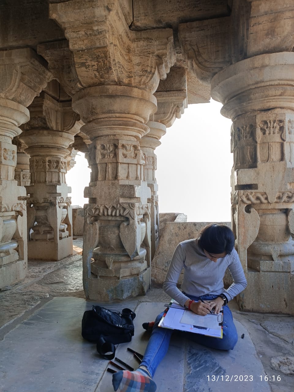 Architect Ankita Peshin is drawing proportionate elevation sketches to note the internal dimensions of the Bisaldeo Temple in the Tonk district of Rajasthan. (Image courtesy: Vrinda Dhiman)