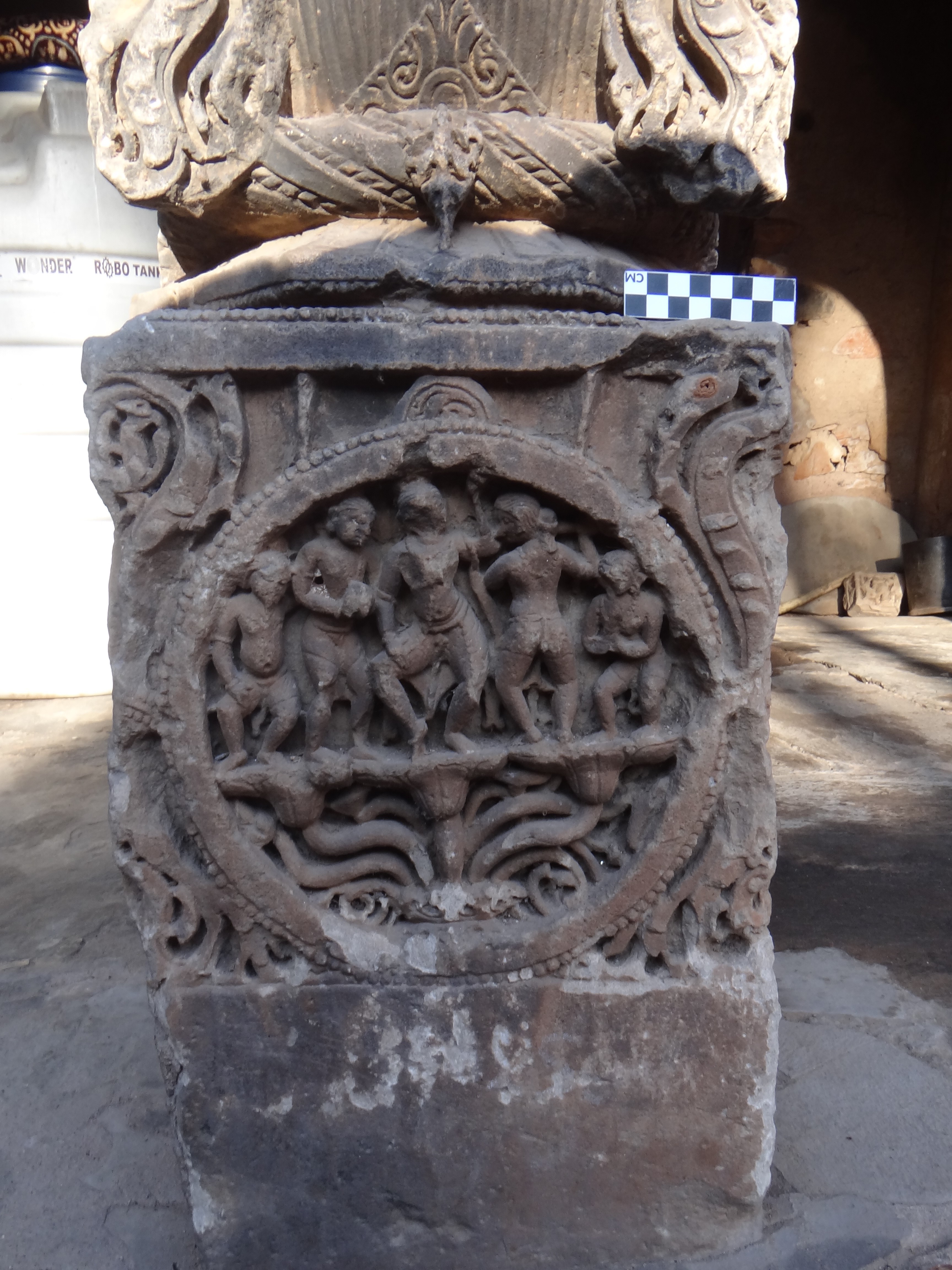 The centimetre grid scale is placed on the pillar to record the proportion of the carvings inside, Harshnath Temple Complex, Sikar district, Rajasthan. (Image courtesy: Mrunal Nidadavolu)