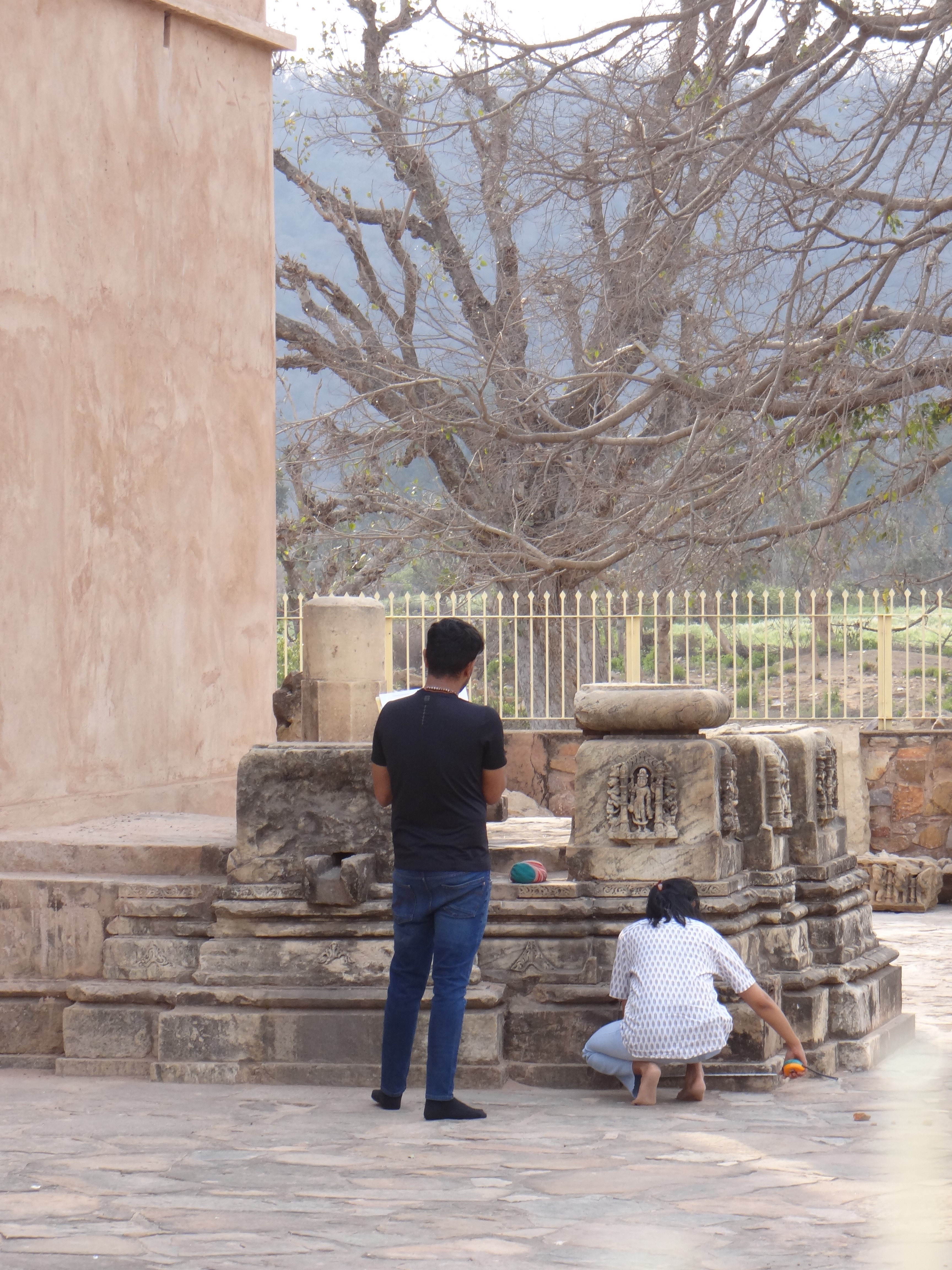 Architect Mrunal Nidadacolu is reading site measurements while Ar. Abhyuday Krishna is noting the same on-site drawing sheets, Neelkanth Group of Temples, Alwar district, Rajasthan. (Image courtesy: Ar. Ankita Peshin)