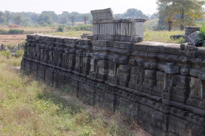 Image 2: A view of the Jagati (raised plinth), interspersed with niches, serves as the foundational base upon which the Chaunsath Yogini Temple stands.