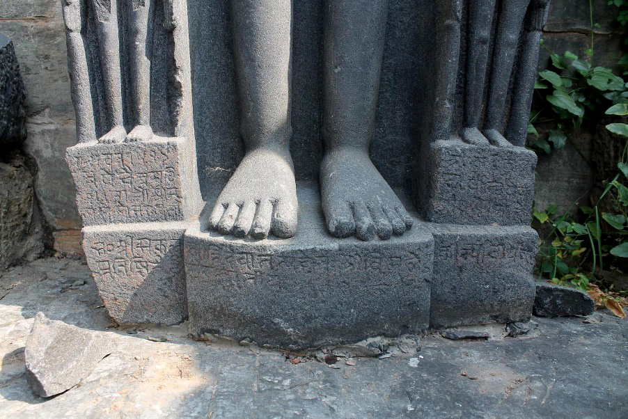 Image 2: Inscriptions on the pedestal of a Jain statue in the Jain Temple remain at Arthuna.