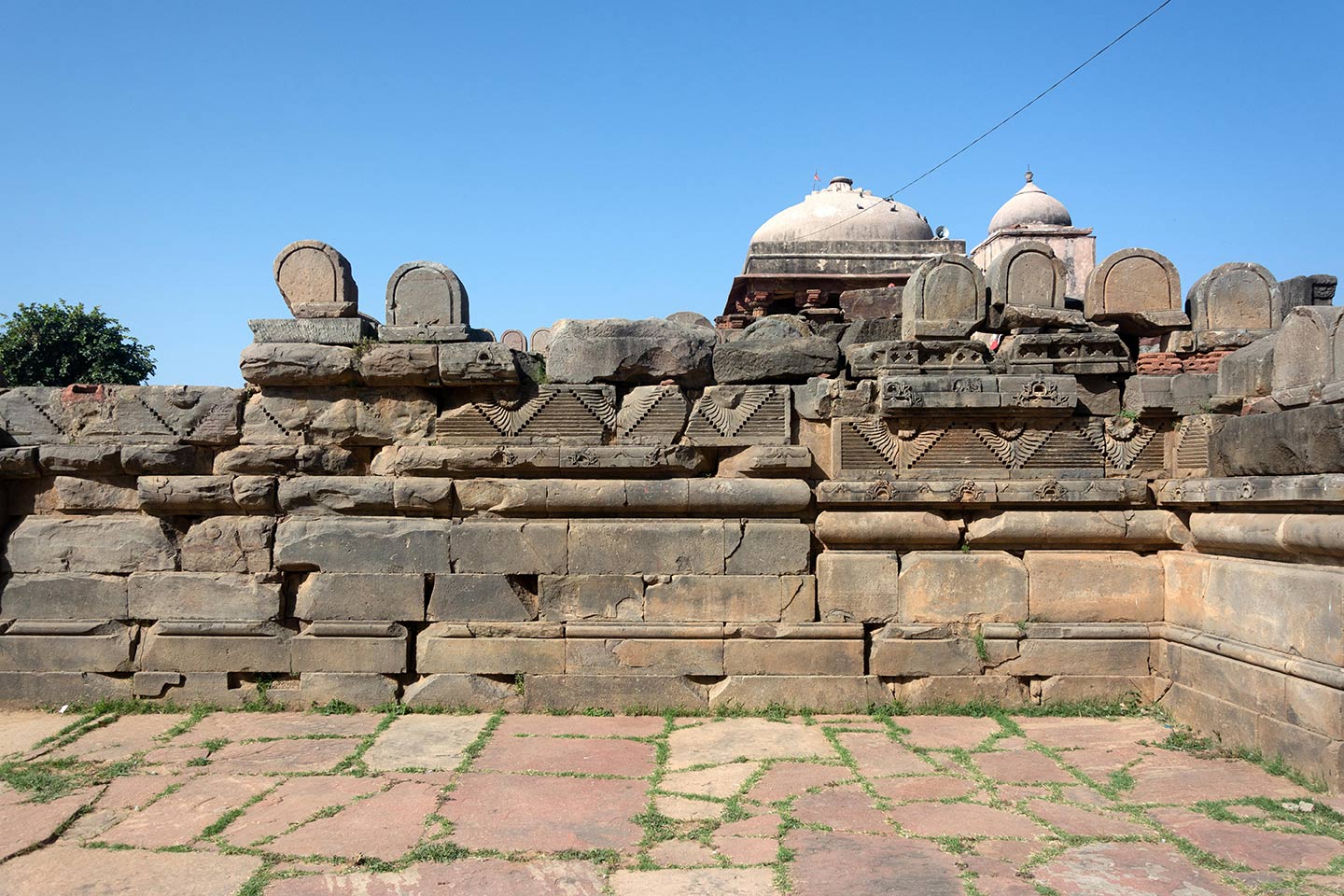 Broken debris from the original temple assembled on the southeast face of the adhisthana.