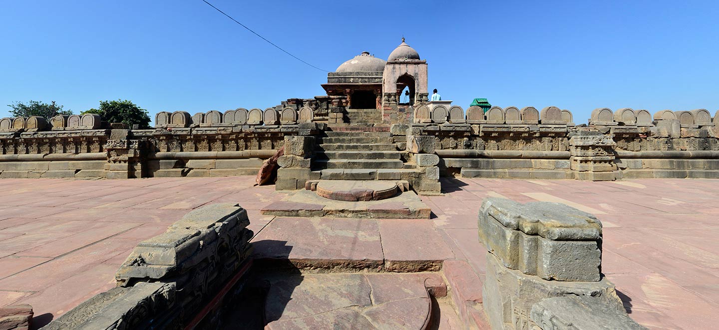 View from the steps on the first level of the adhisthana. The adhisthana has a chandrashila (moonstone) on the landing (seen in the foreground) of the first set of steps and the beginning (seen in the centre) of the second set of steps. The moonstone is a hemispherical stone in the shape of the moon which is often placed at the entrance of Hindu temples and is designed to resemble a lotus flower.