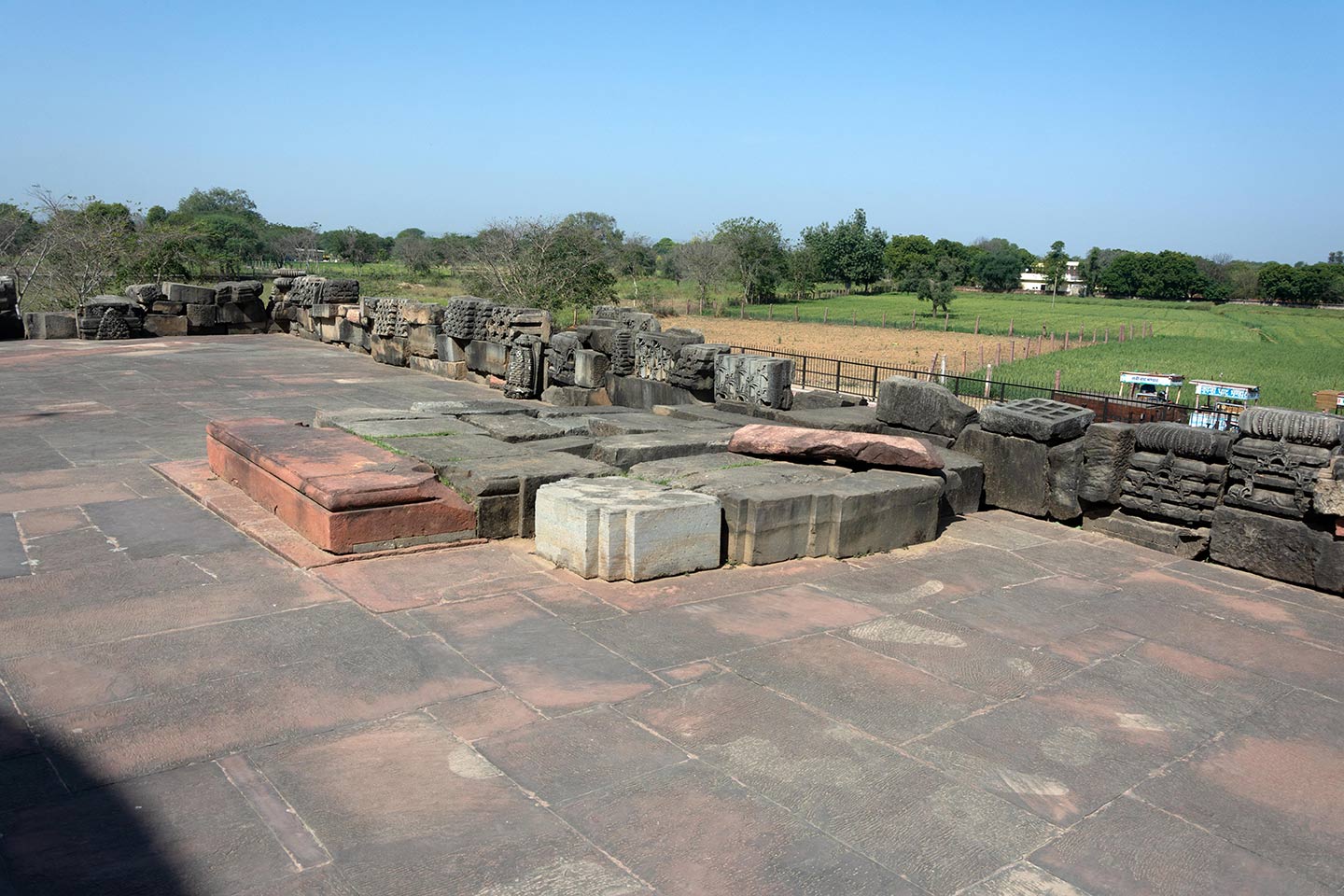 Broken fragments and debris from the original temple assembled on the north face of the adhisthana. The fragments assembled here were once part of the original temple, and other subsidiary structures of the Panchayatana plan.