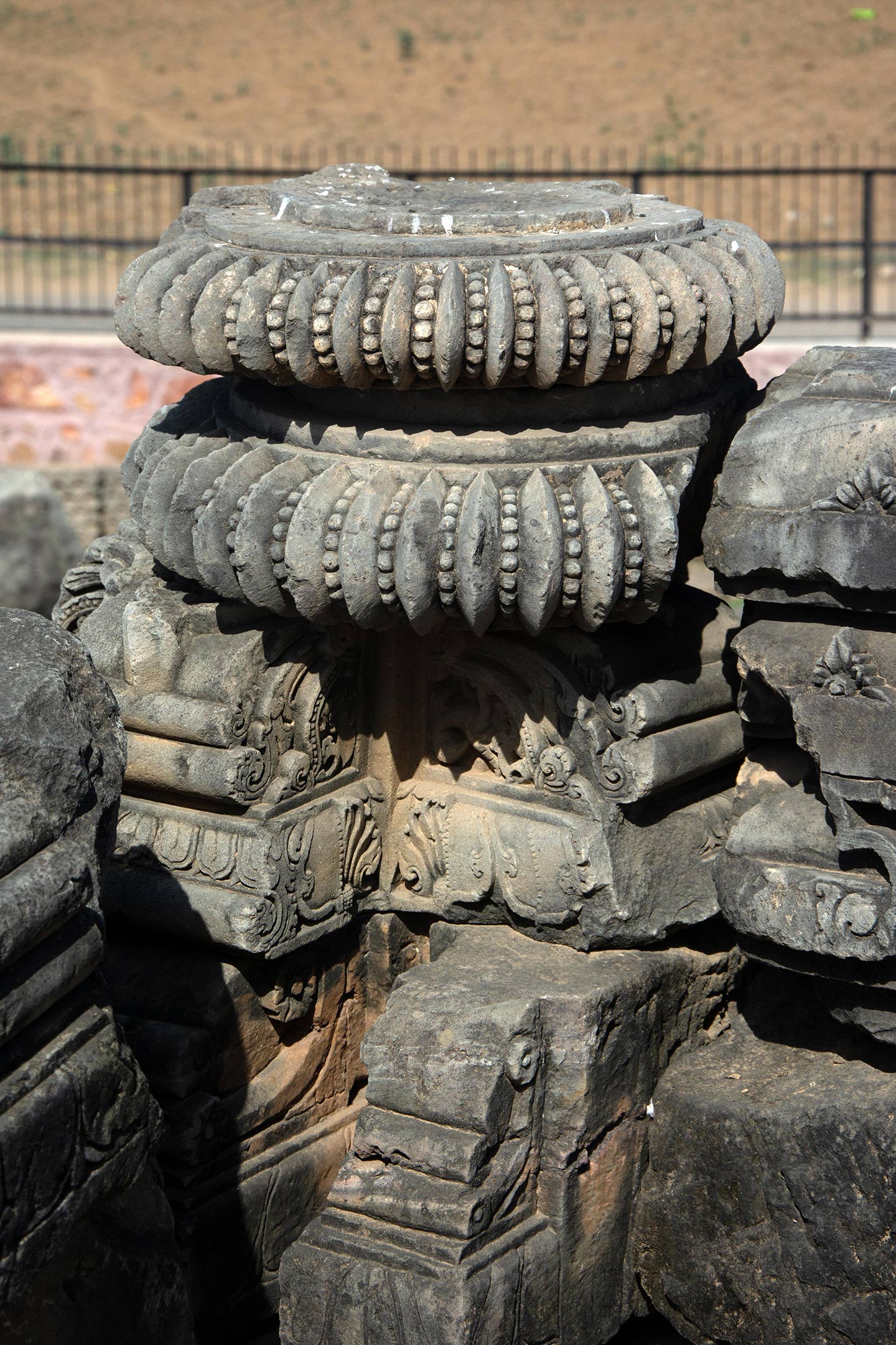Most fragments assembled here were once part of the shikhara of the original temple, other subsidiary structures, and associated parts like the amalaka (notched disc) as seen here.