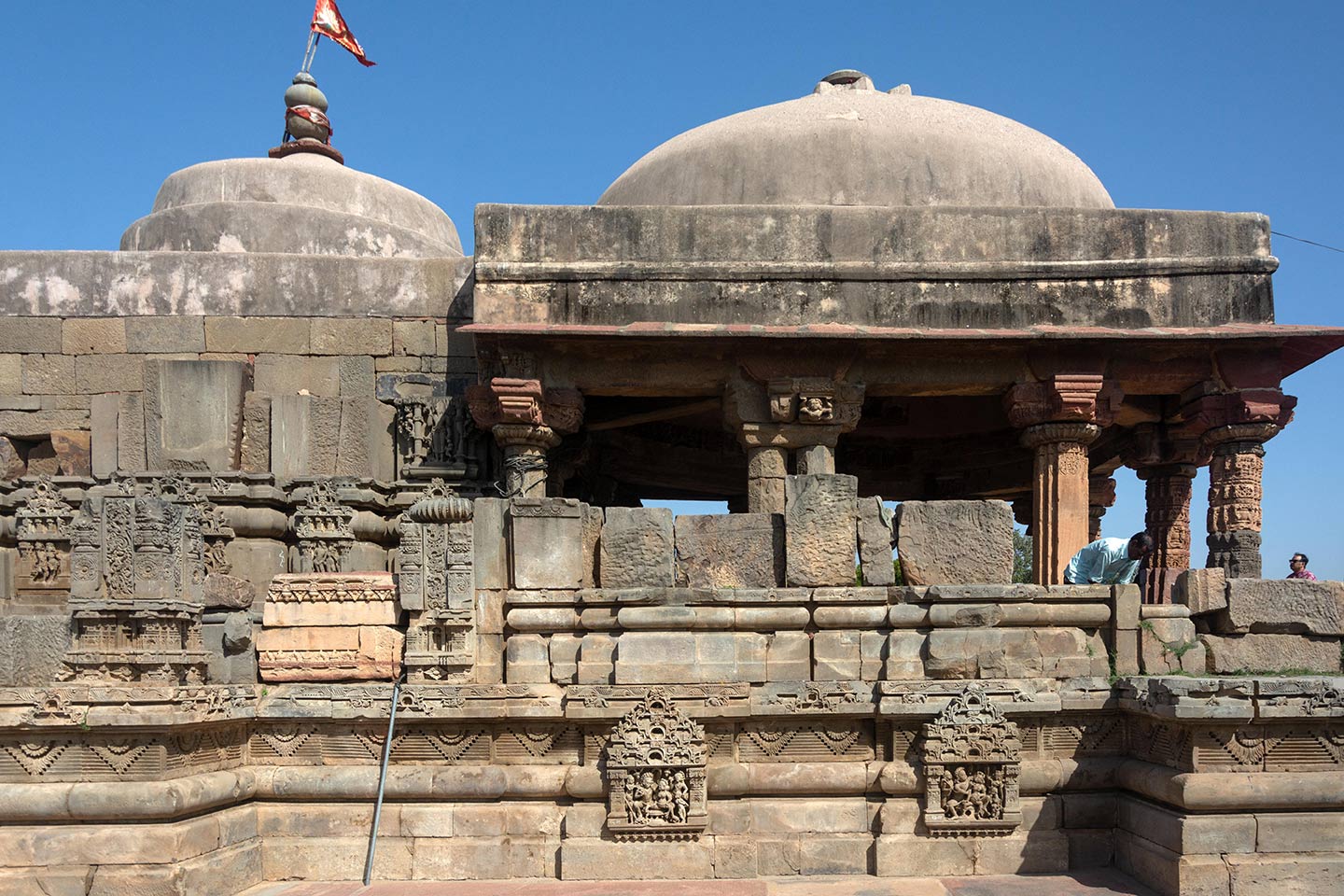 The space in front of the garbhagriha (sanctum sanctorum) is the maha mandapa which is used as a congregation space and for conducting rituals. Instead of the traditional shikhara over the garbhagriha, the temple was reconstructed with concrete domes over the garbhagriha and the maha mandapa.