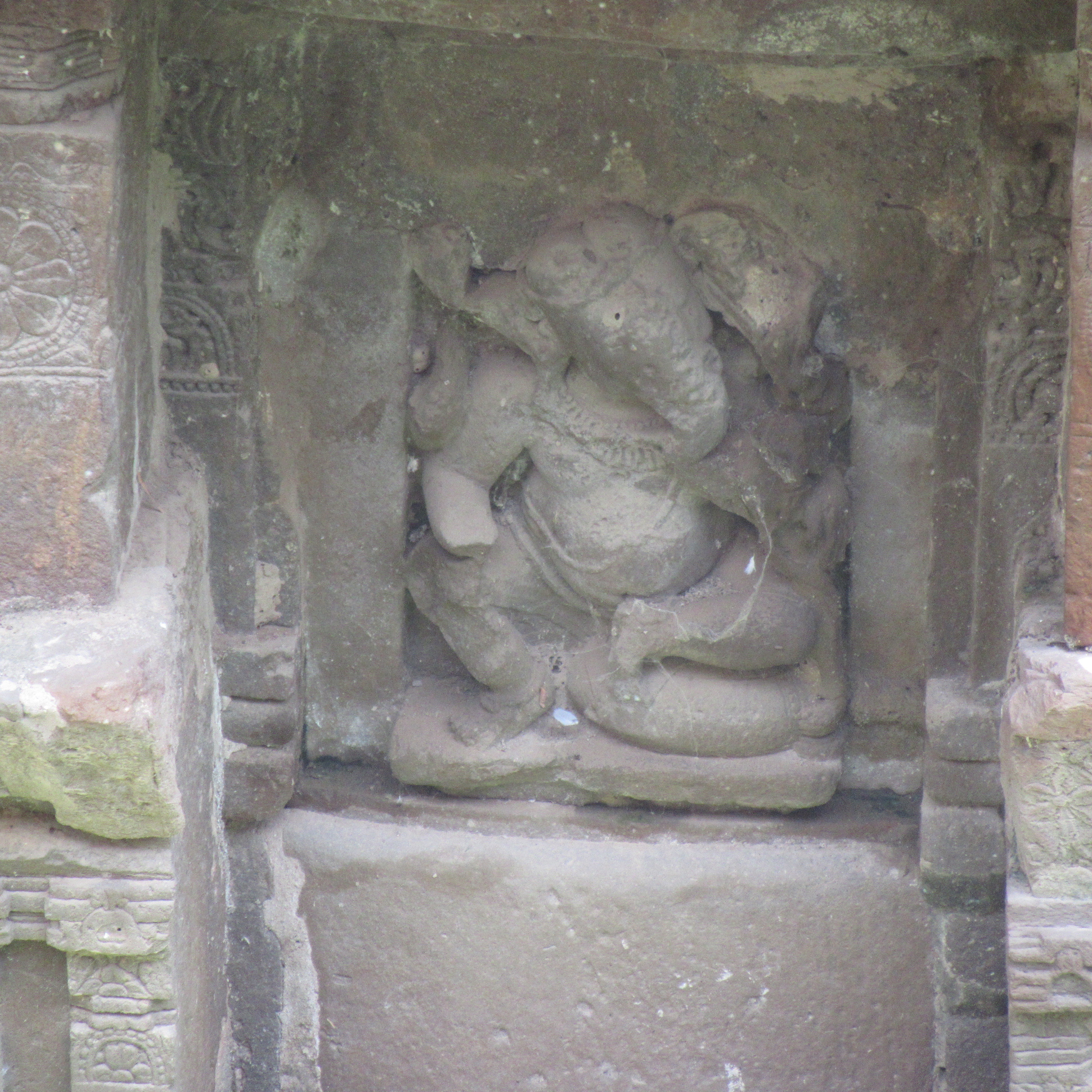 Image 3: Four-armed male deity seated in lalitasana on a cushion. It is stylistically similar to the multiple Ganesha images recovered from the Harshatmata Temple.
