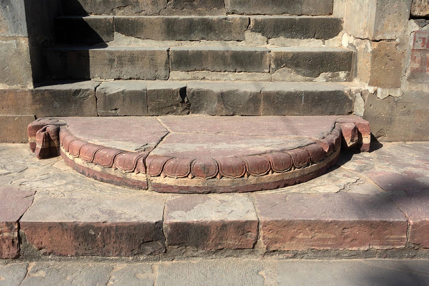 Image 3: The steps on the adhisthana have a chandrashila (moonstone) on the third step. Moonstone is a hemispherical stone in the shape of the moon placed at the entrance of Hindu temples and is designed like a lotus flower.